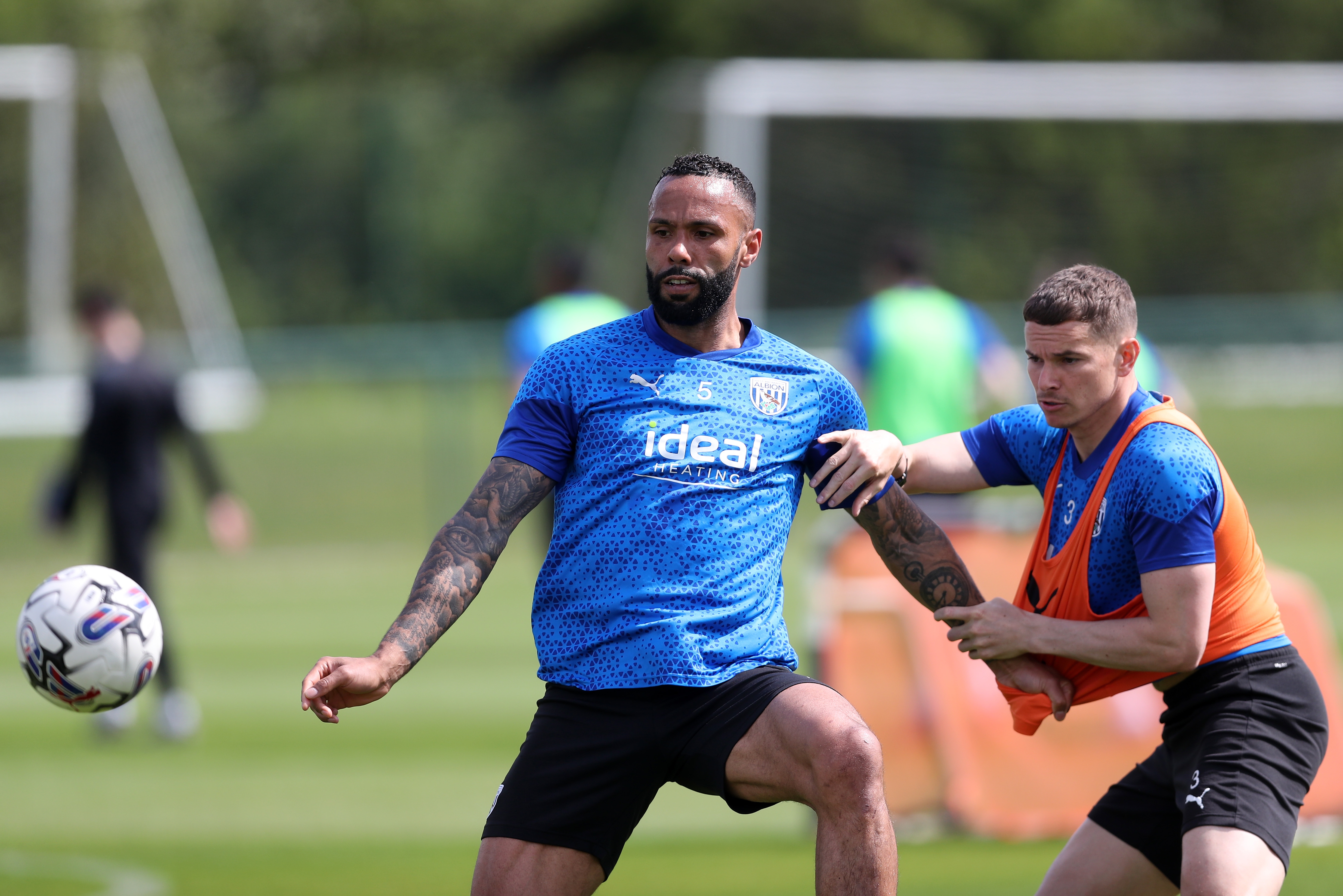 Kyle Bartley fighting Conor Townsend for the ball in training 