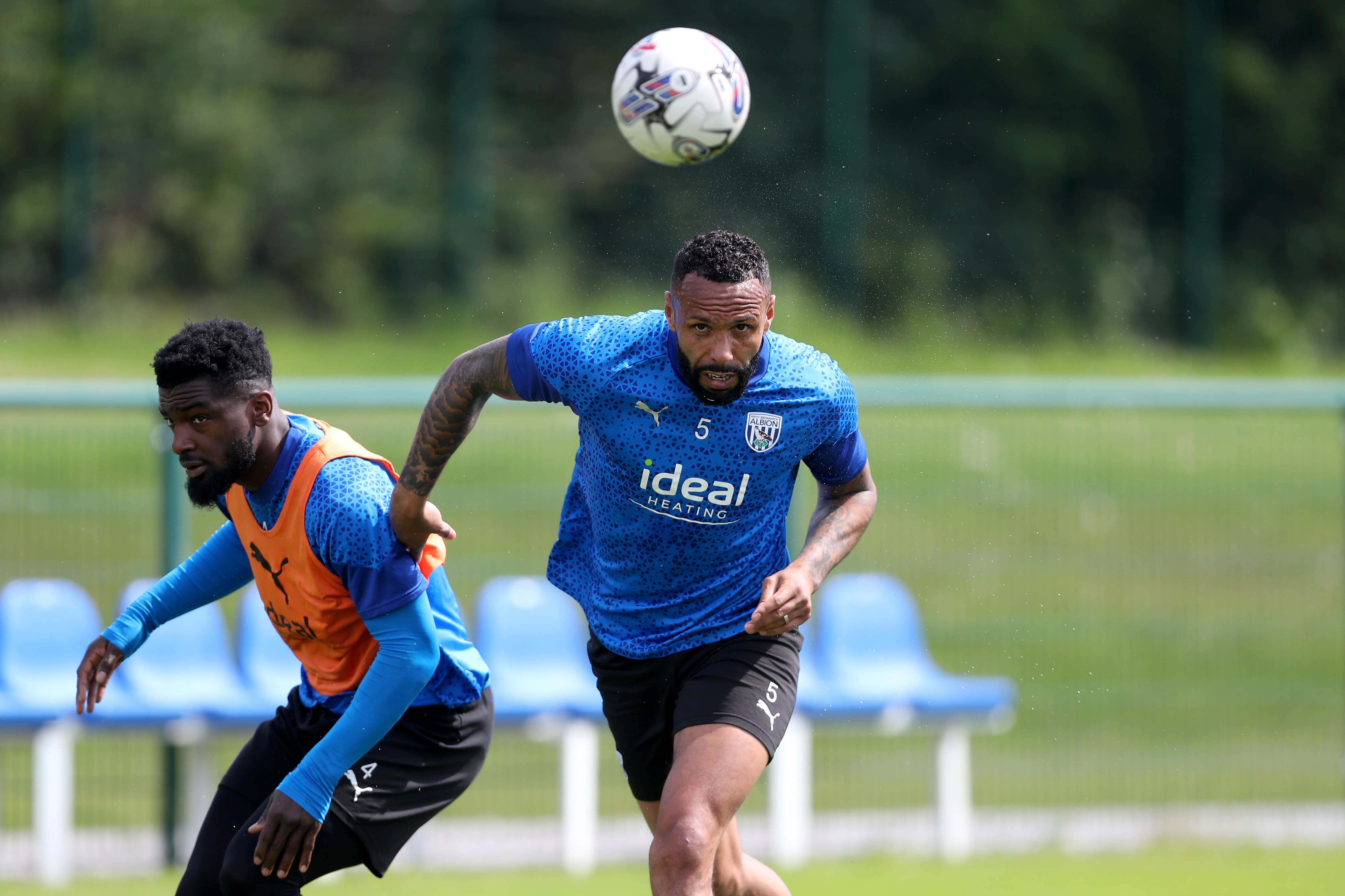 Kyle Bartley heading the ball during training