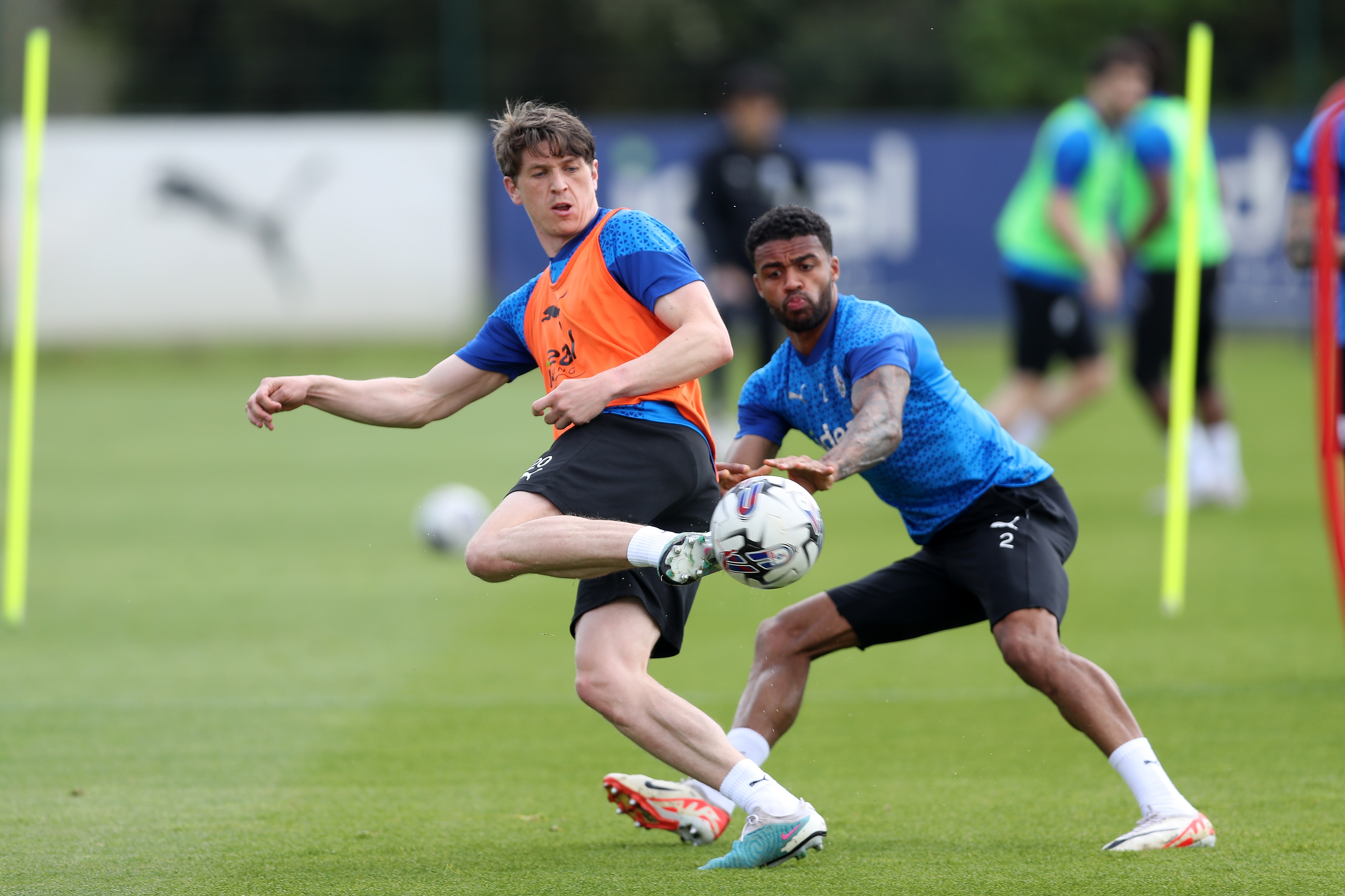 Adam Reach and Darnell Furlong battle for the ball during training 