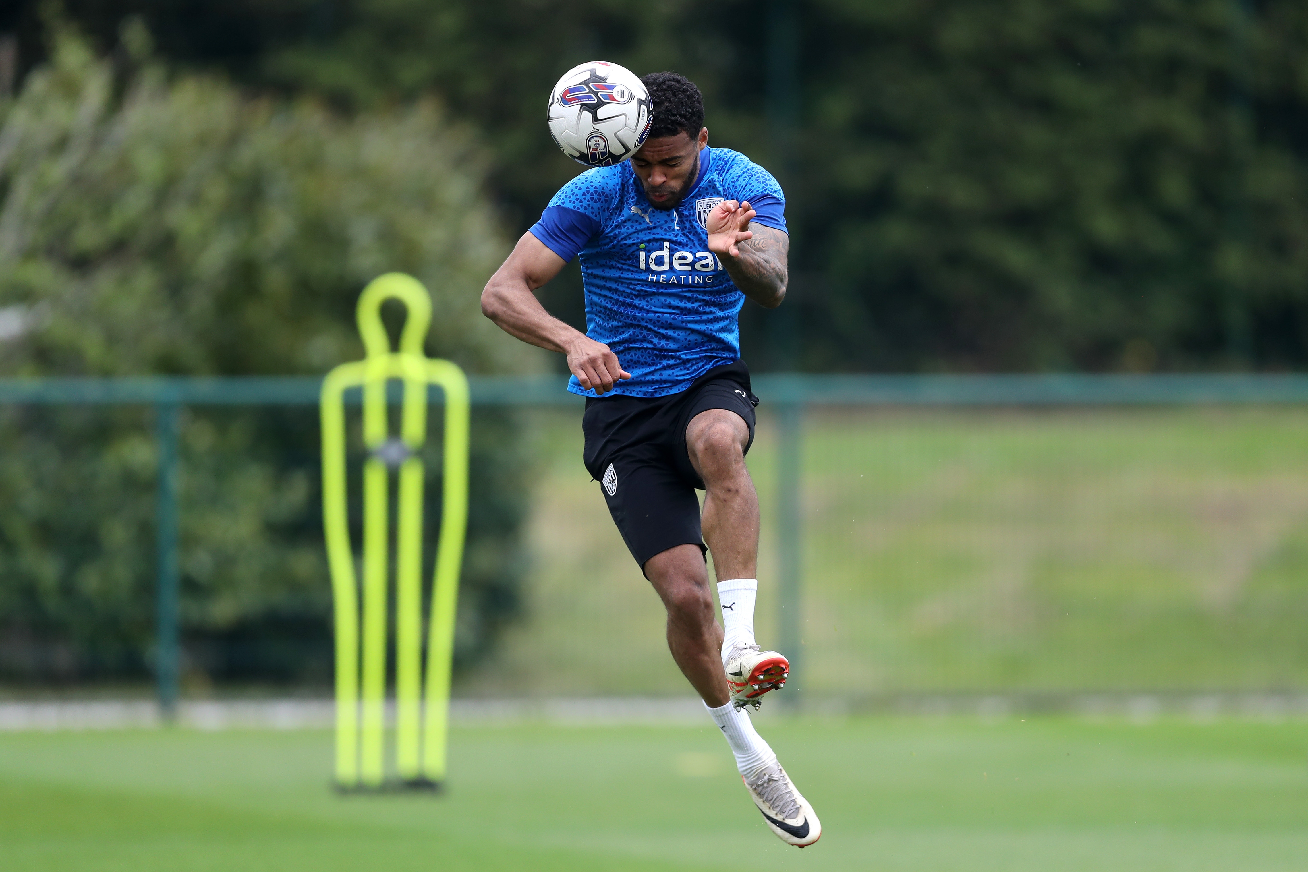 Darnell Furlong heading the ball during a training session
