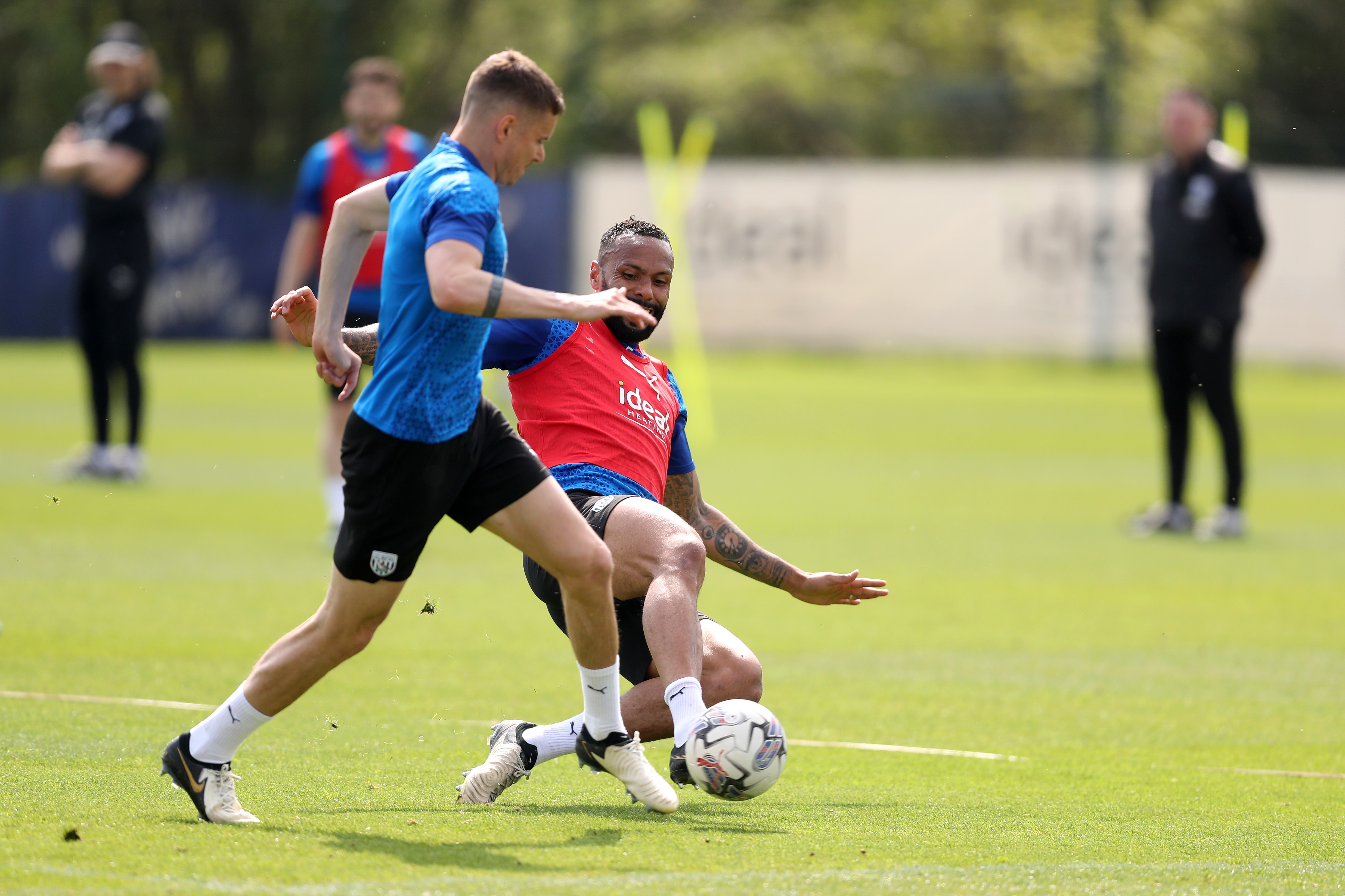 Kyle Bartley tackling Conor Townsend during training 