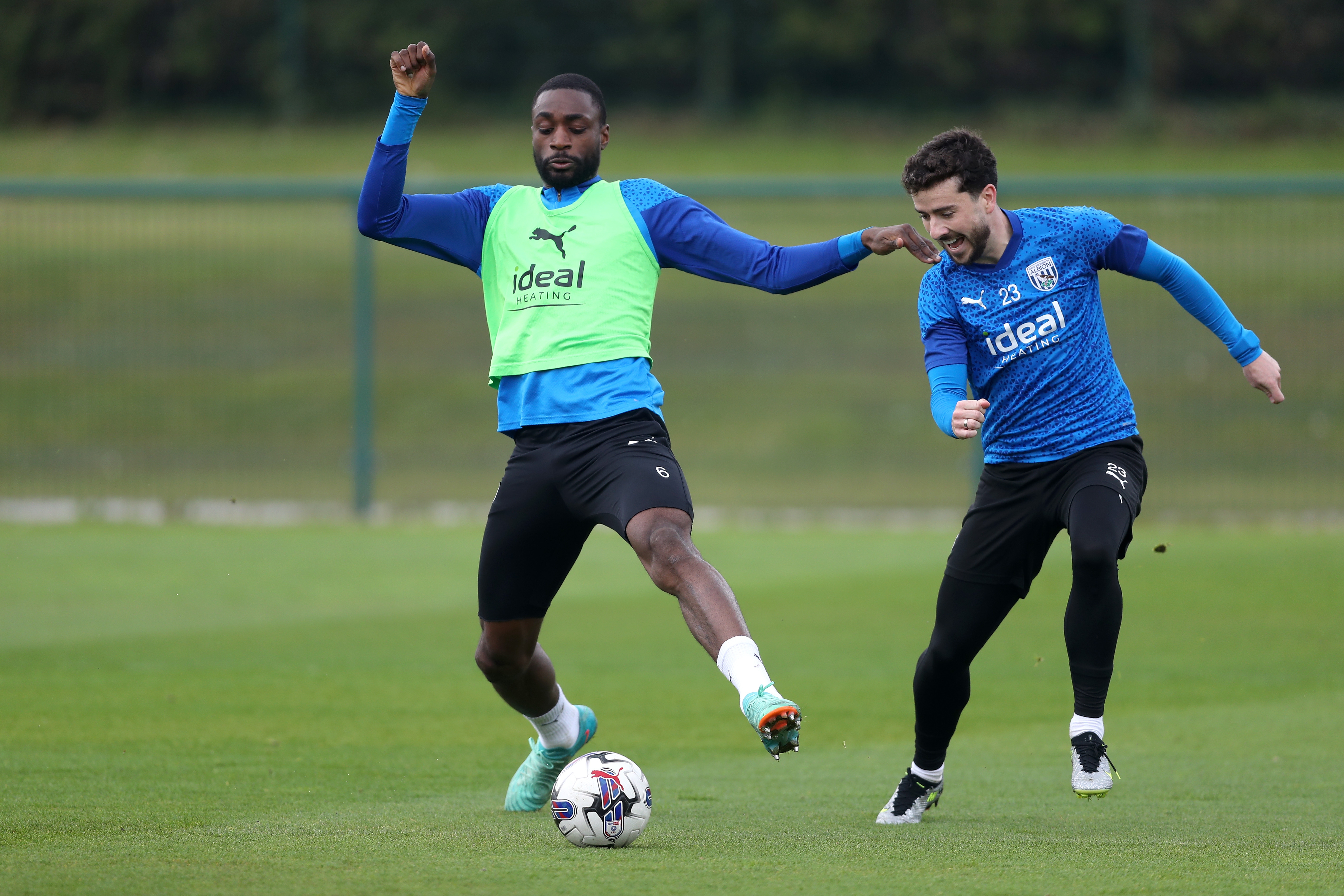 Semi Ajayi and Mikey Johnston fighting for the ball during a training session