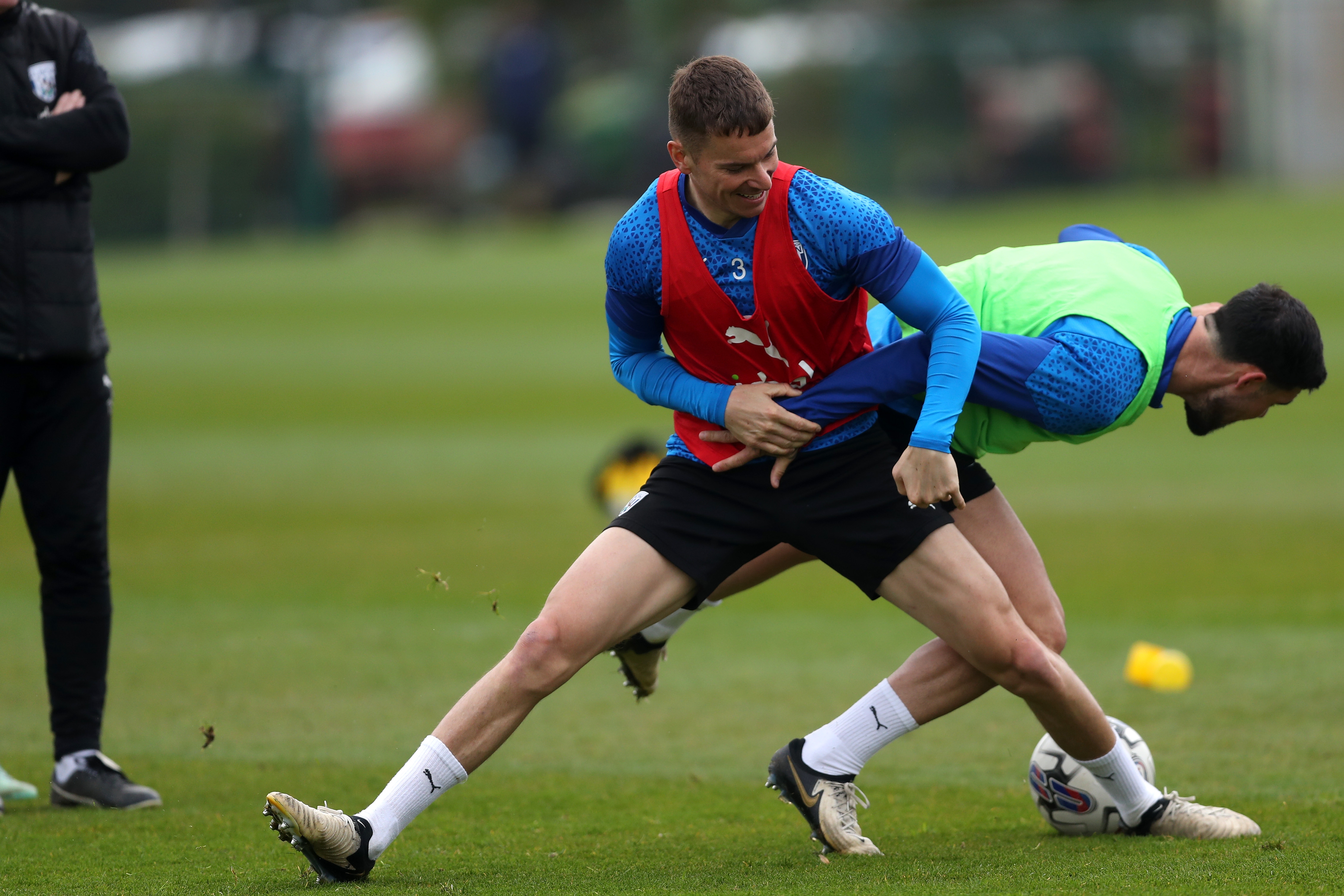 Conor Townsend and Alex Mowatt fighting for the ball during a training session 