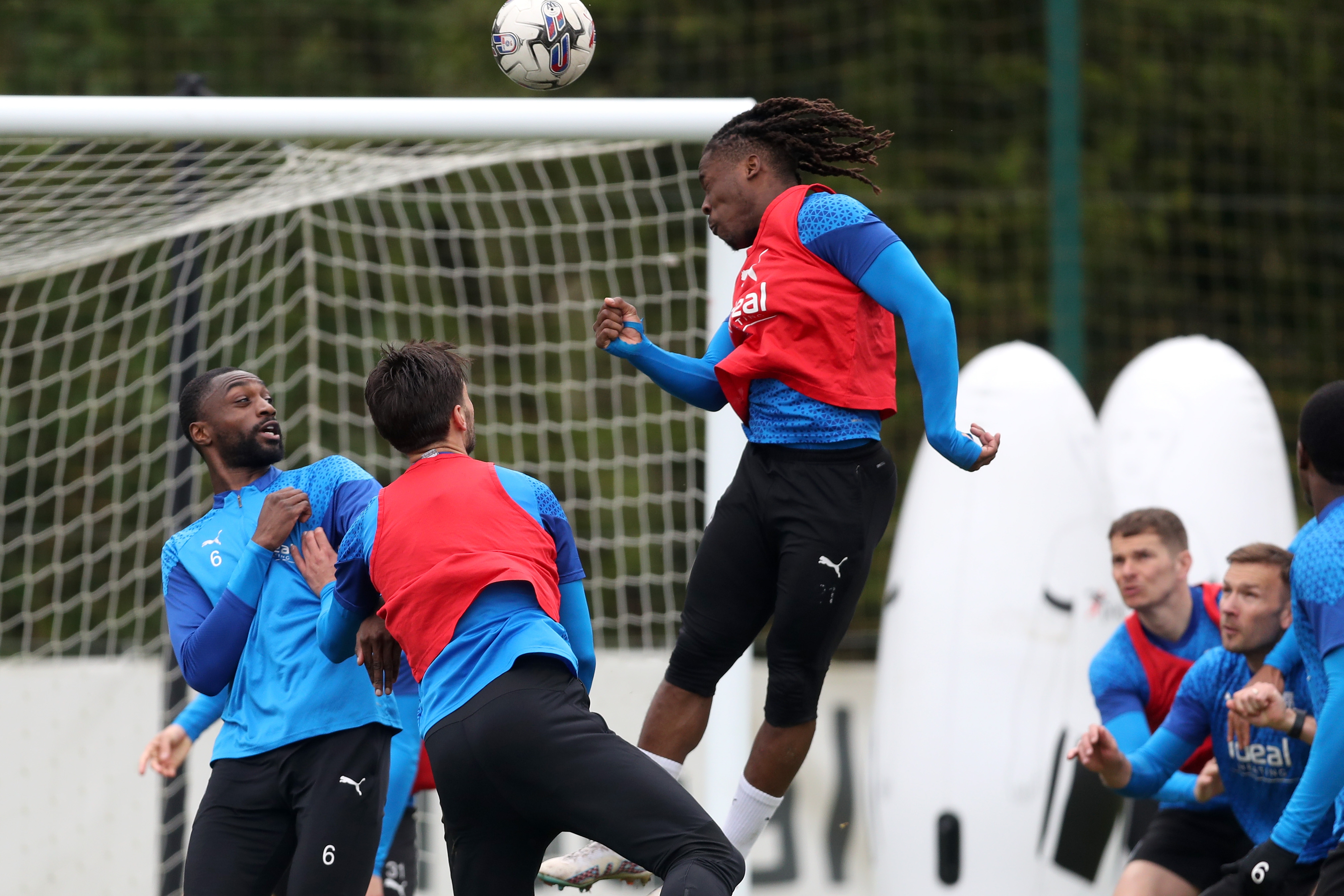 Brandon Thomas-Asante heads towards goal during a training session 