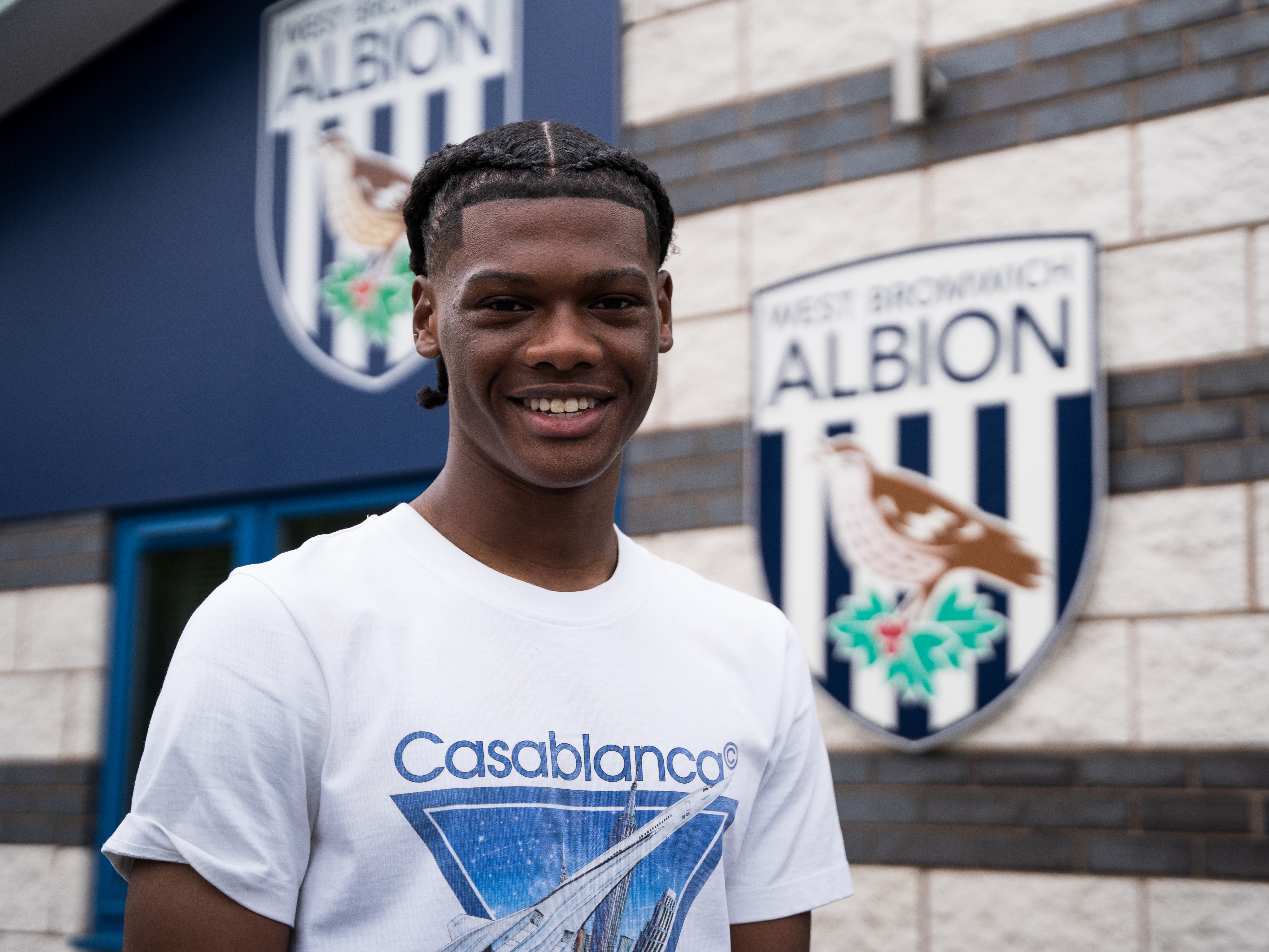 A photo of academy graduate Adriel Walker standing outside the club's training ground