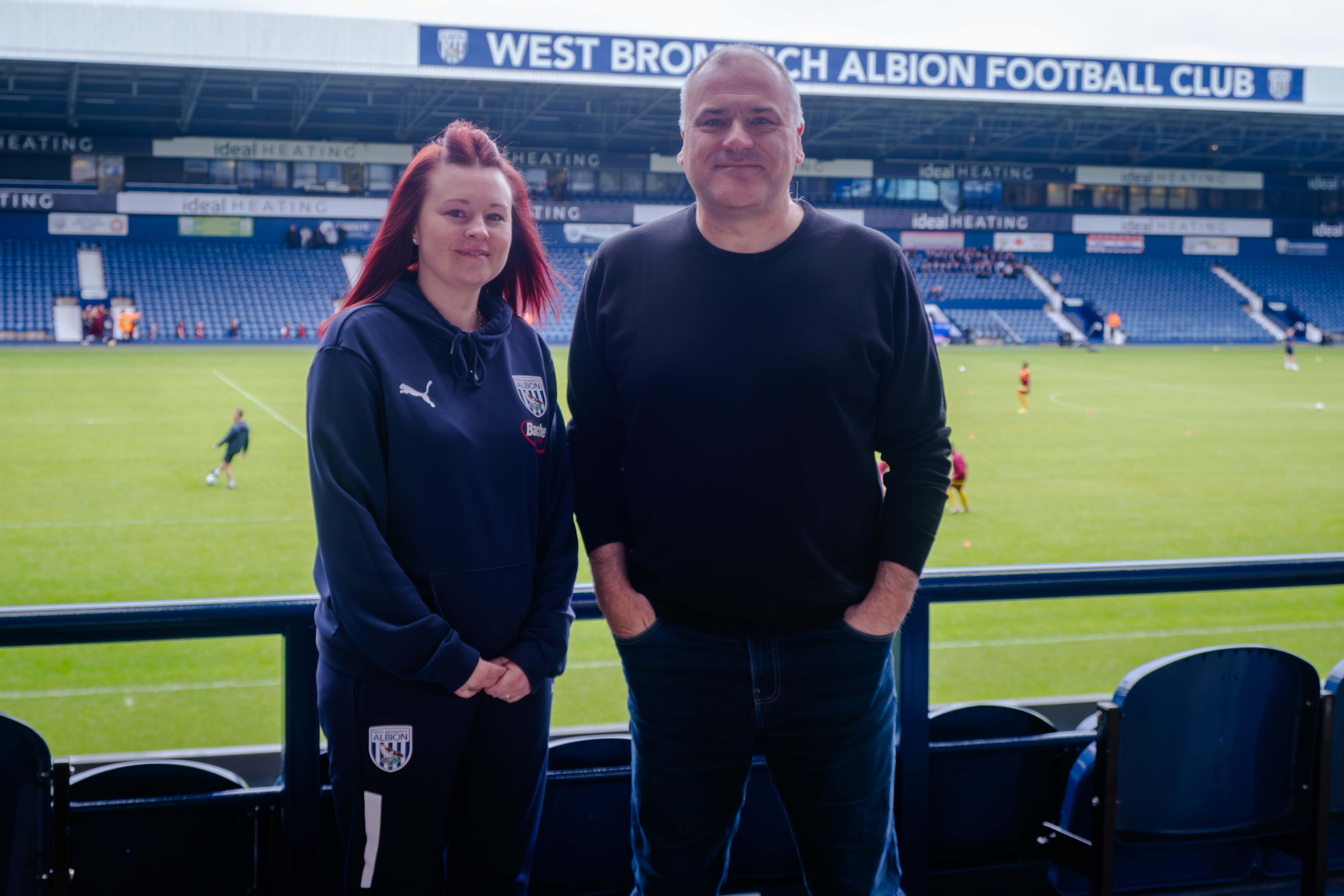 Bennett Whitehouse standing on the East stand with the West stand signage in the background.