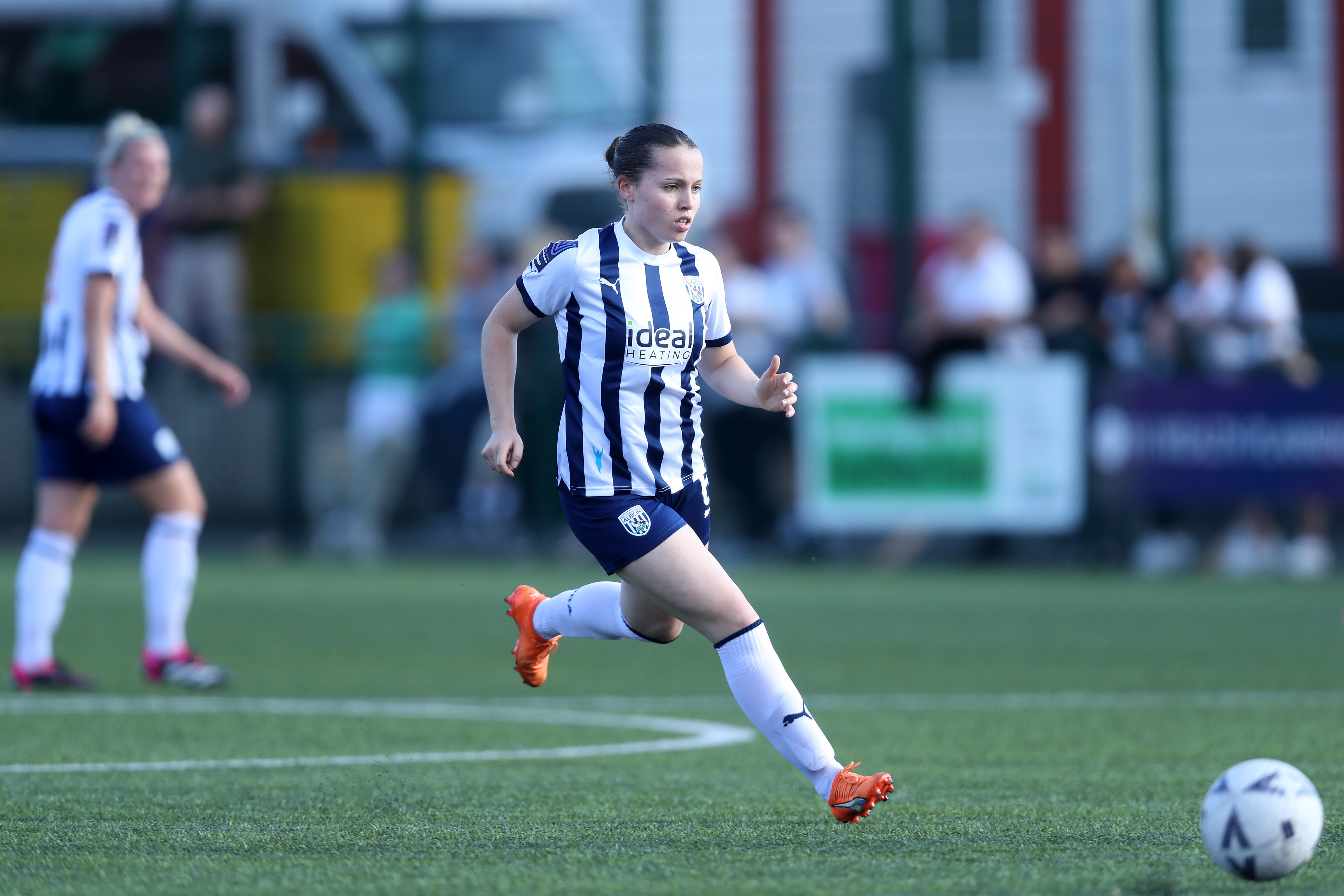 Abi Loydon in action for Albion Women wearing the home kit 