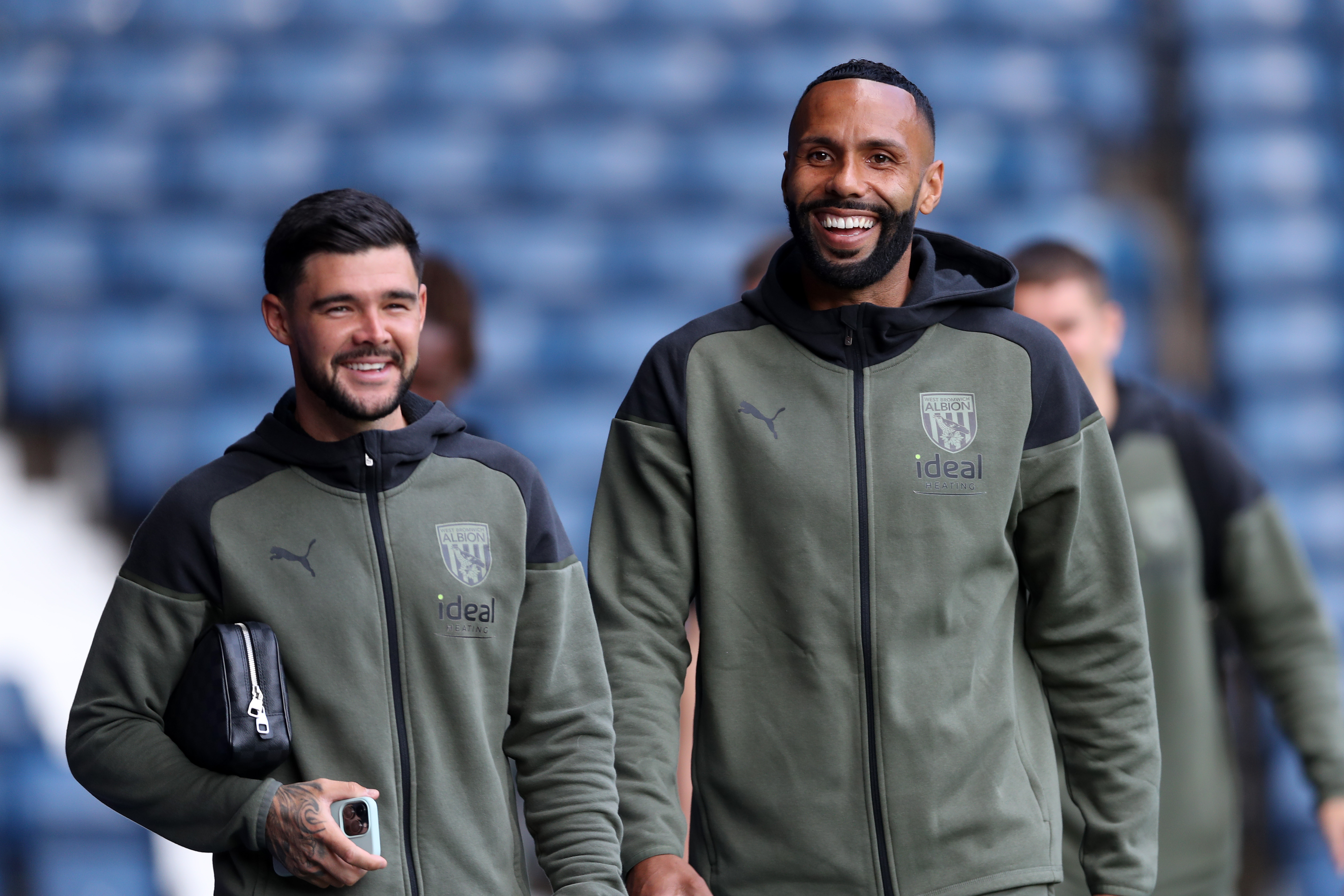 Alex Mowatt and Kyle Bartley arriving for a game at The Hawthorns wearing Albion tracksuits 