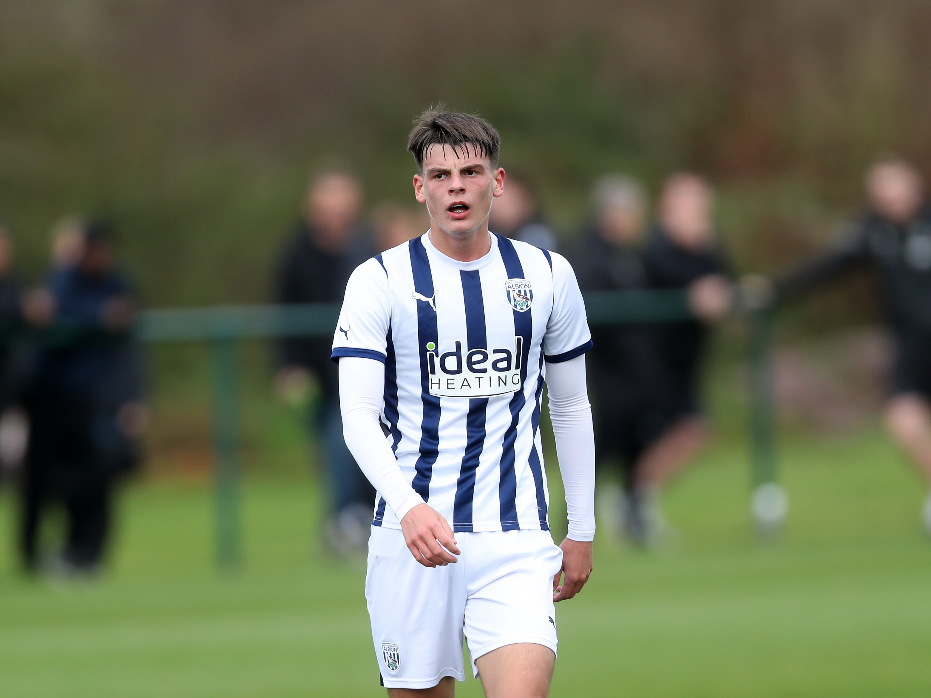 Archie Kirton in action for Albion's U18 team wearing the home kit