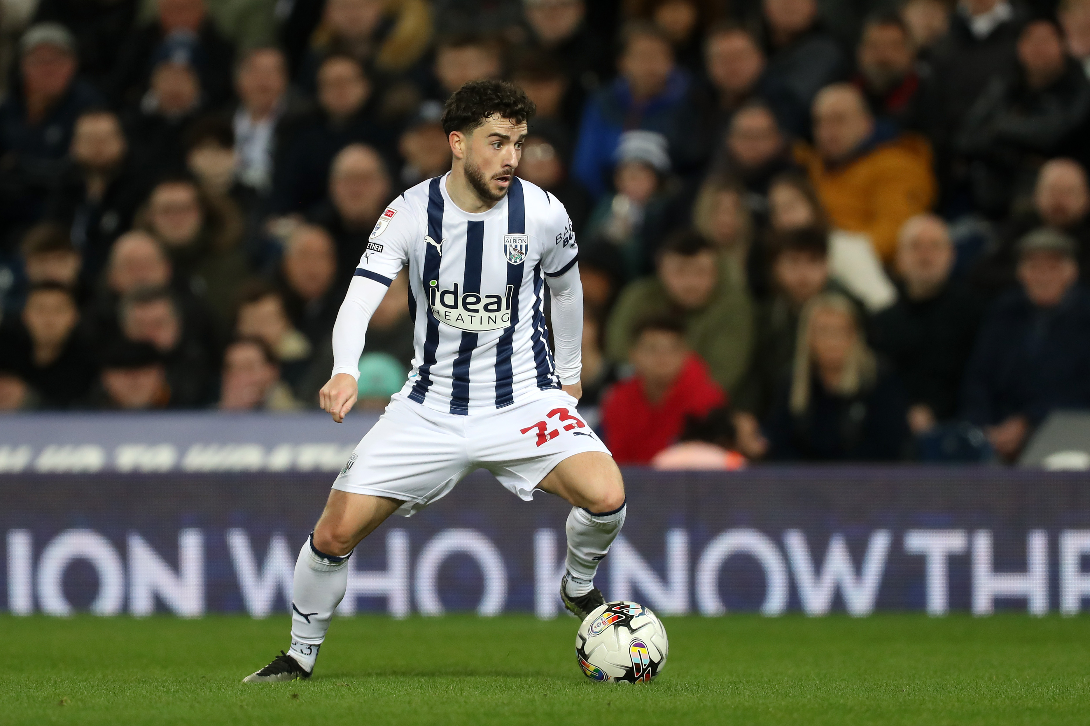 Mikey Johnston on the ball for Albion wearing the home kit during a game at The Hawthorns