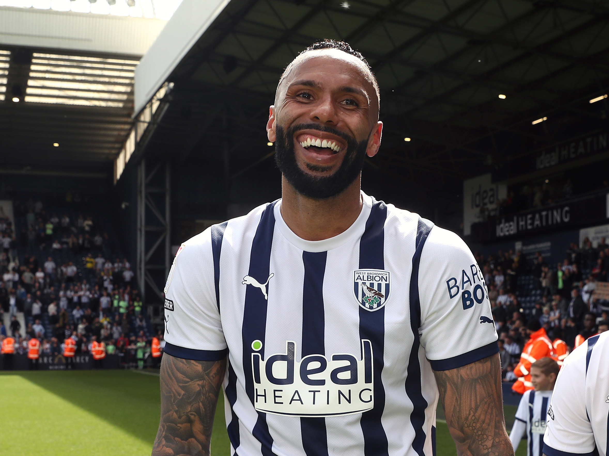 Kyle Bartley laughing at the end of the Preston game wearing a home shirt 