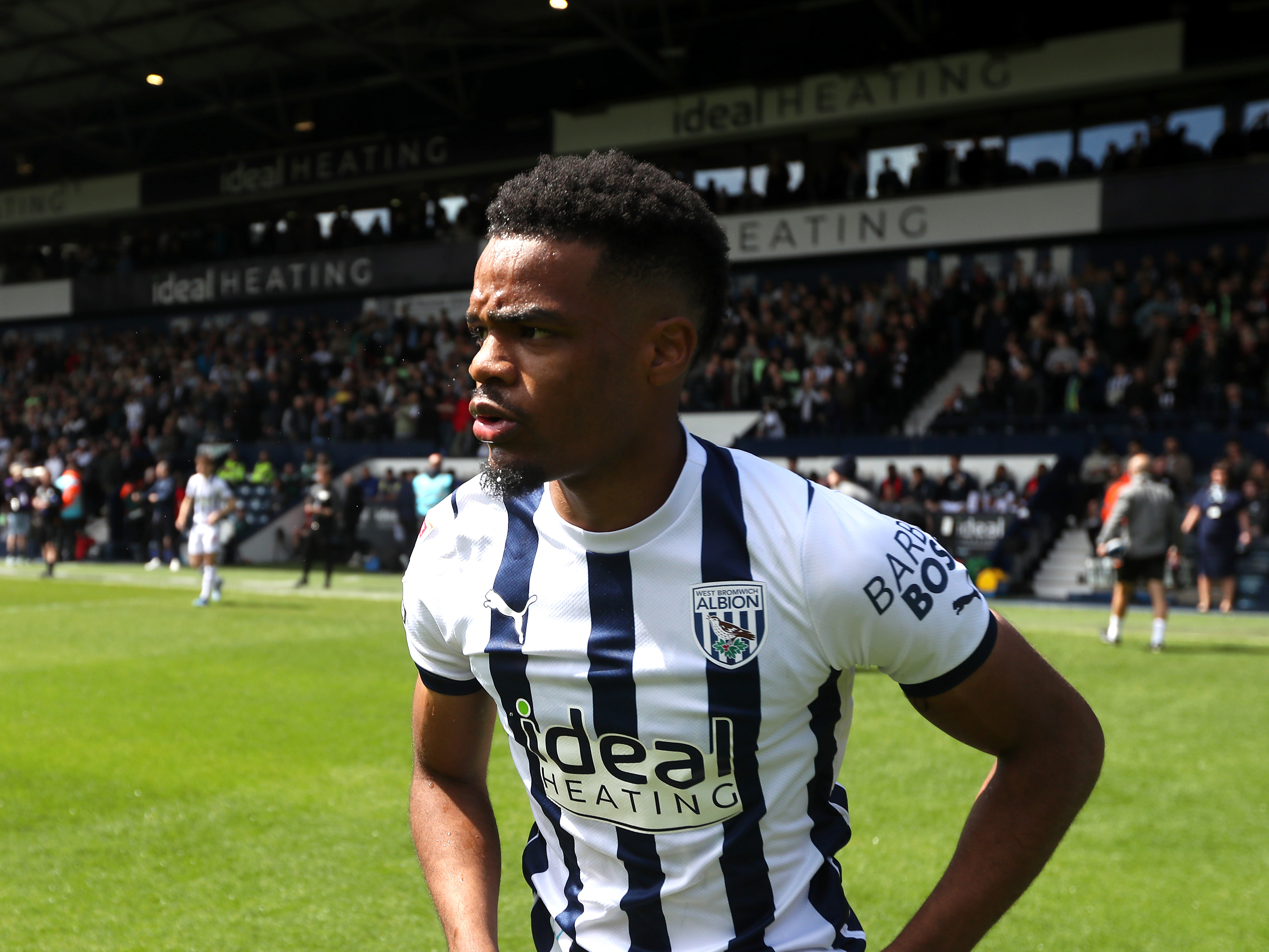 Grady Diangana on the pitch before a match at The Hawthorns in the home kit 