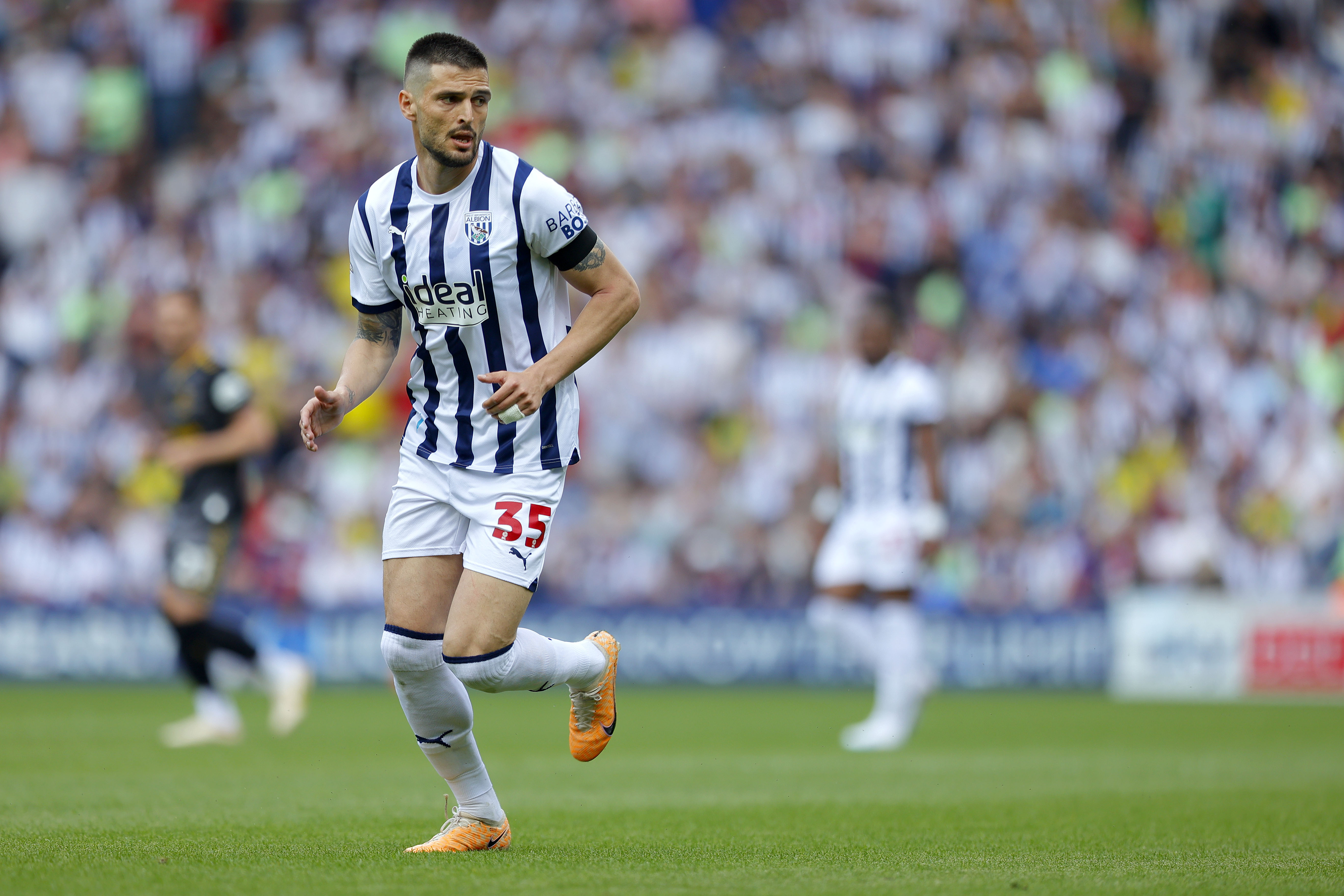Okay Yokuslu in action for Albion against Southampton at The Hawthorns wearing the home kit
