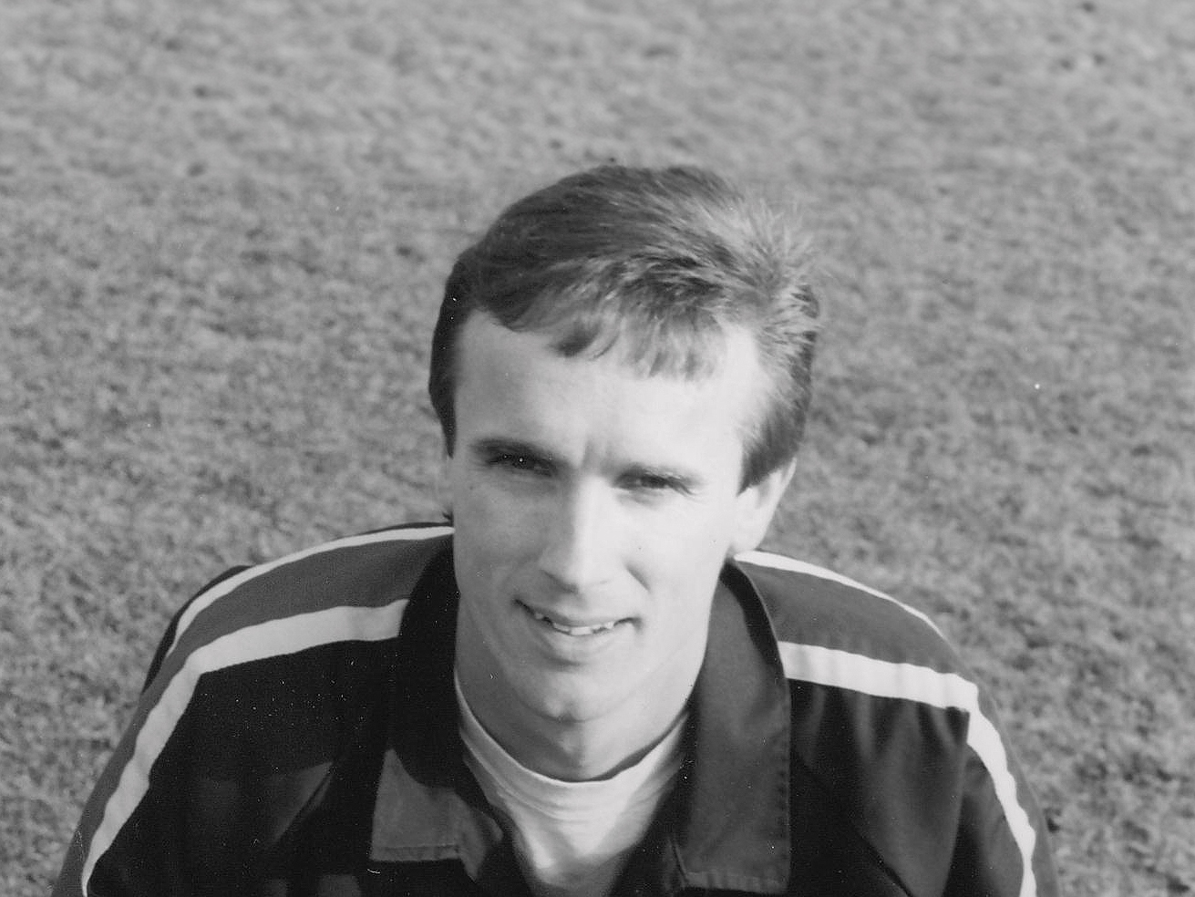 A black and white headshot image of former Albion player Paul Holmes