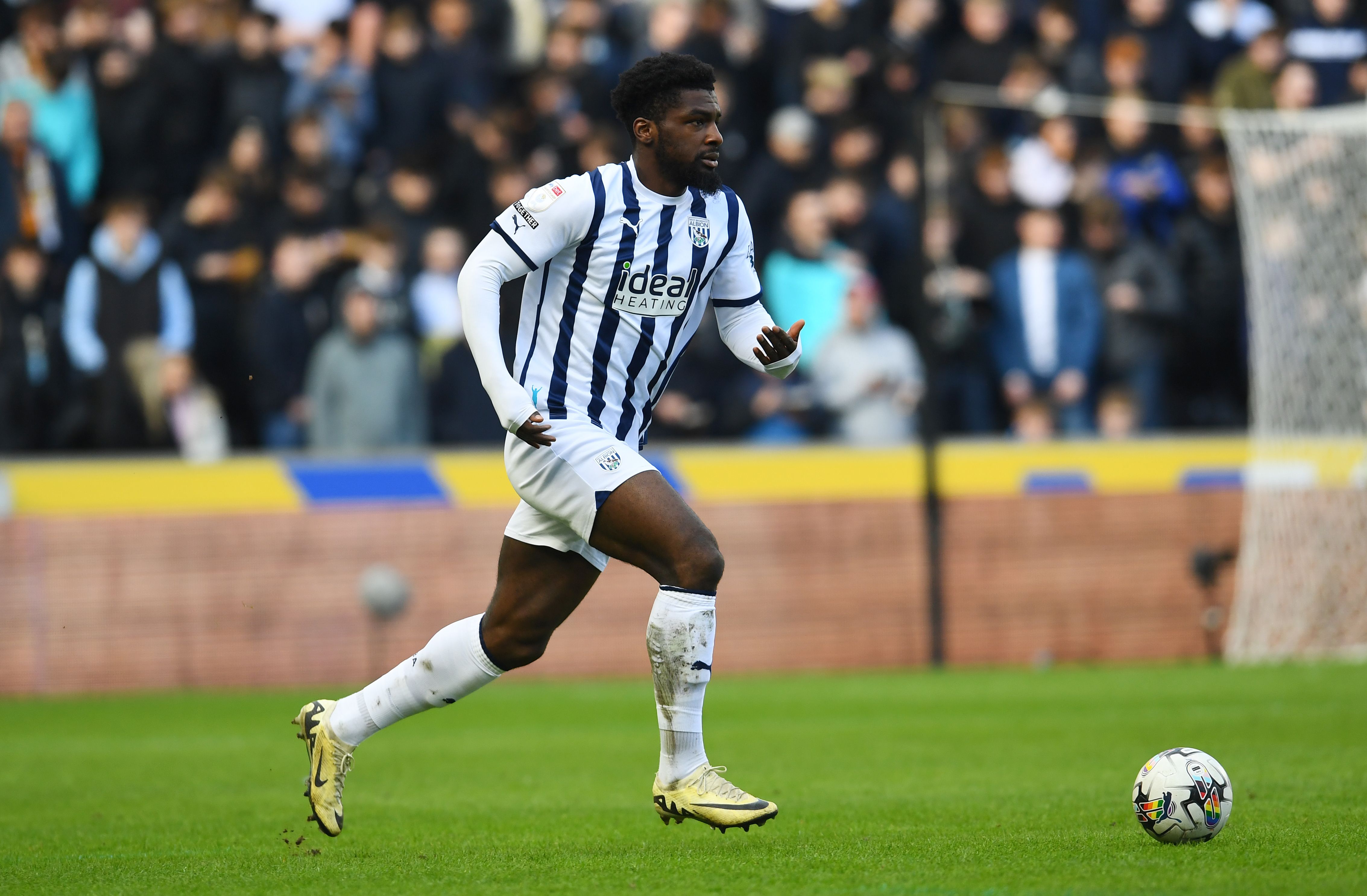Cedric Kipre in action for Albion wearing the home kit 