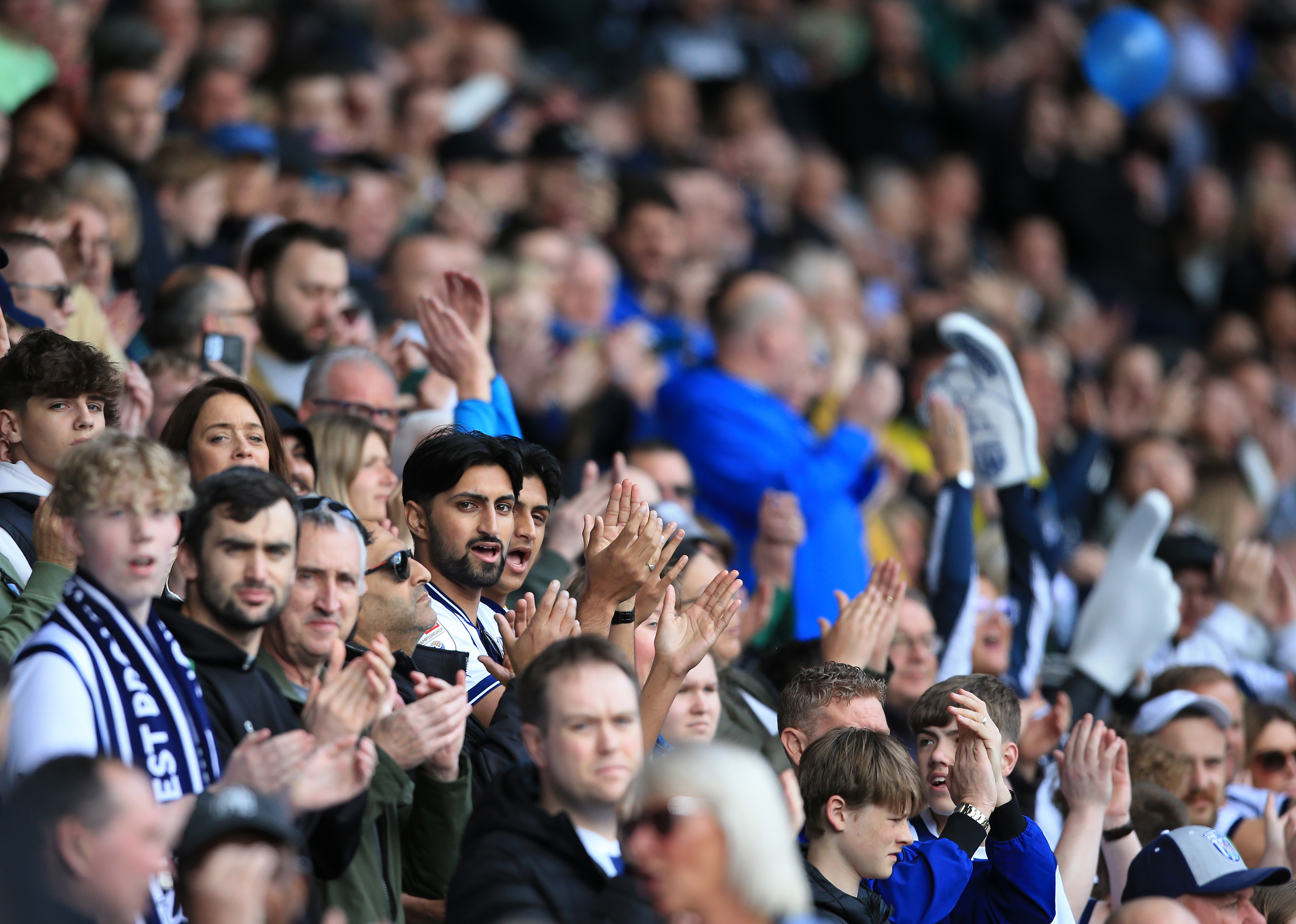 A general view of Albion fans applauding the team at a game 