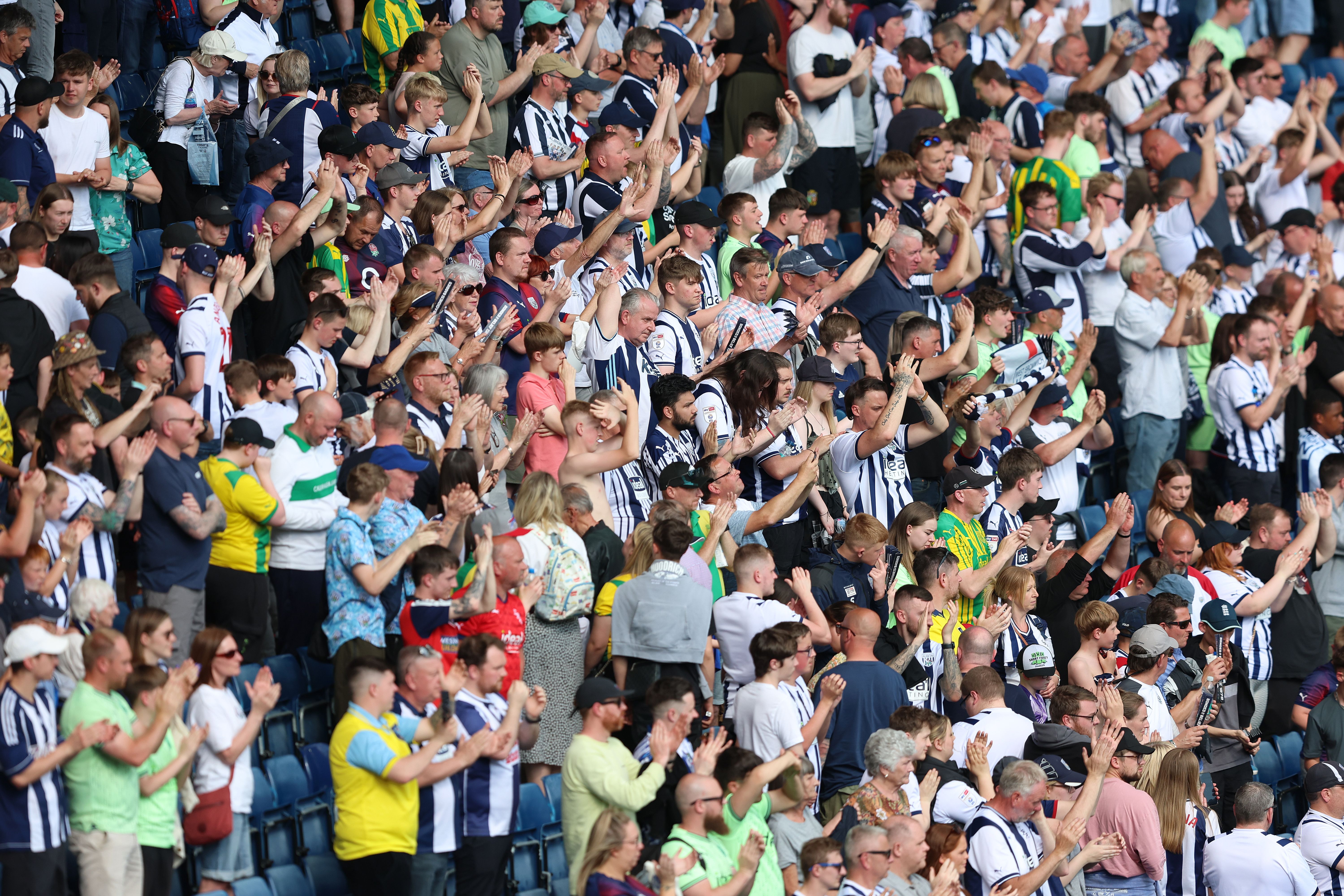 A general view of Albion fans applauding the players 