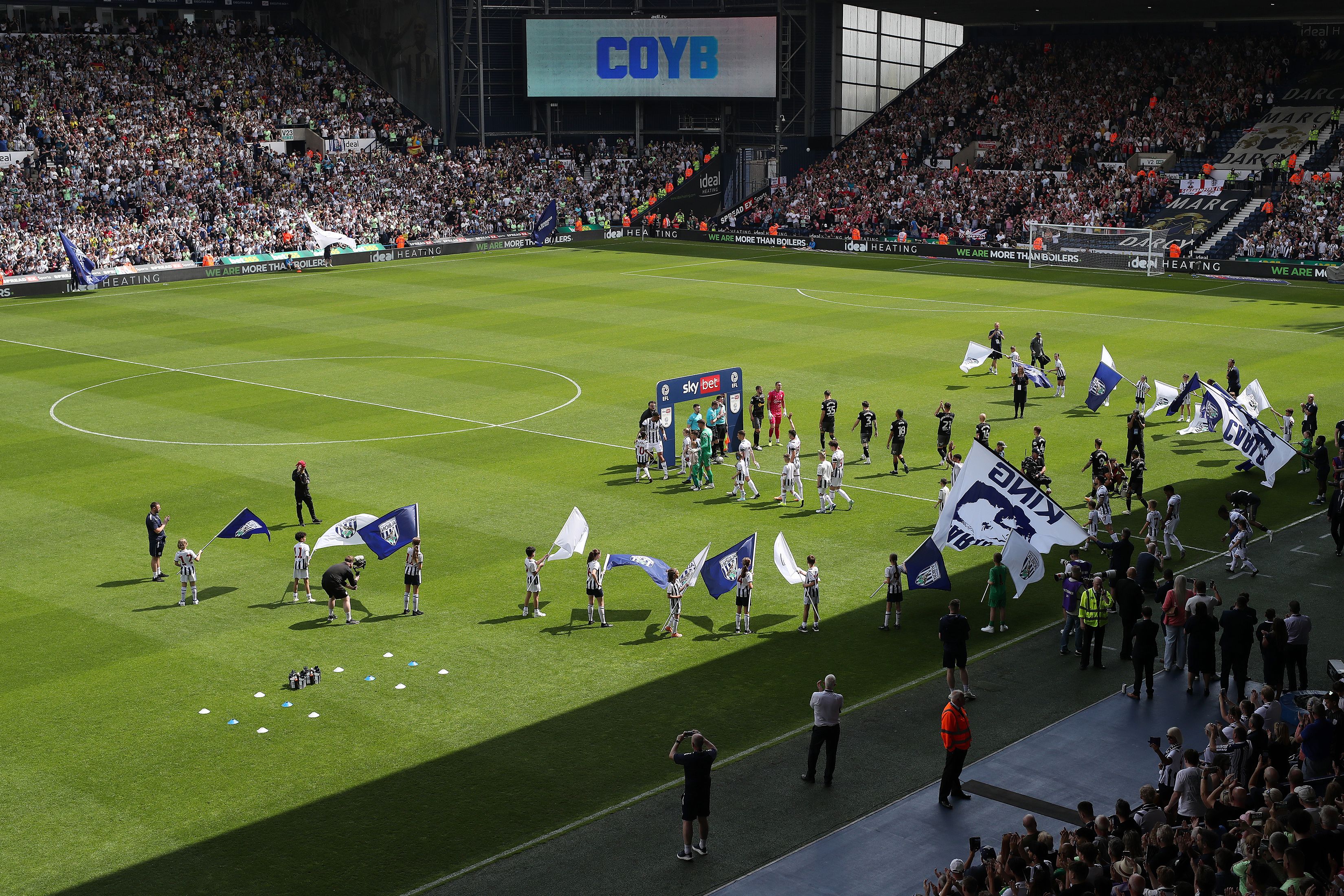 A general view of the two teams stepping out onto the pitch at The Hawthorns 