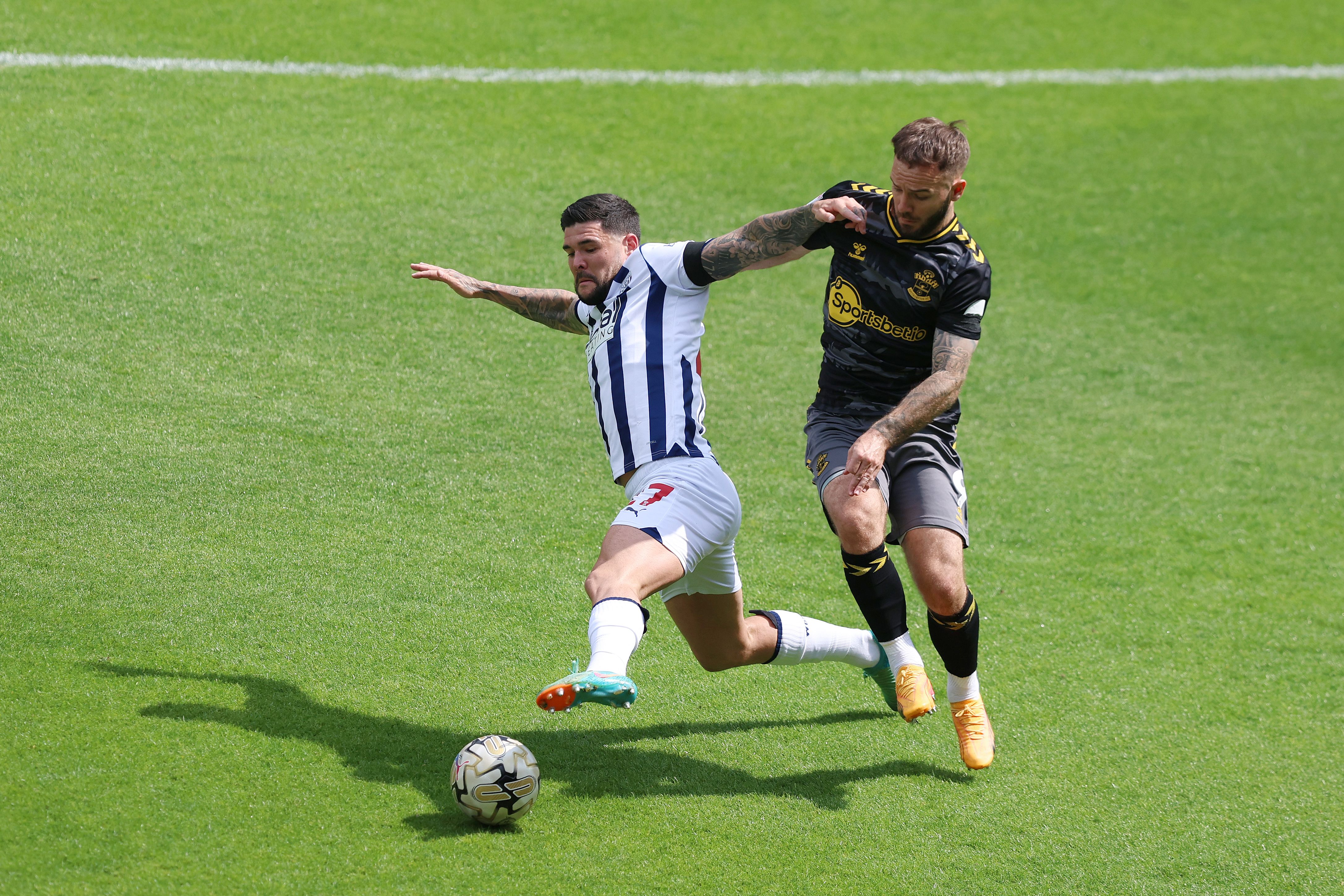 Alex Mowatt stretches to win the ball against Southampton at The Hawthorns 