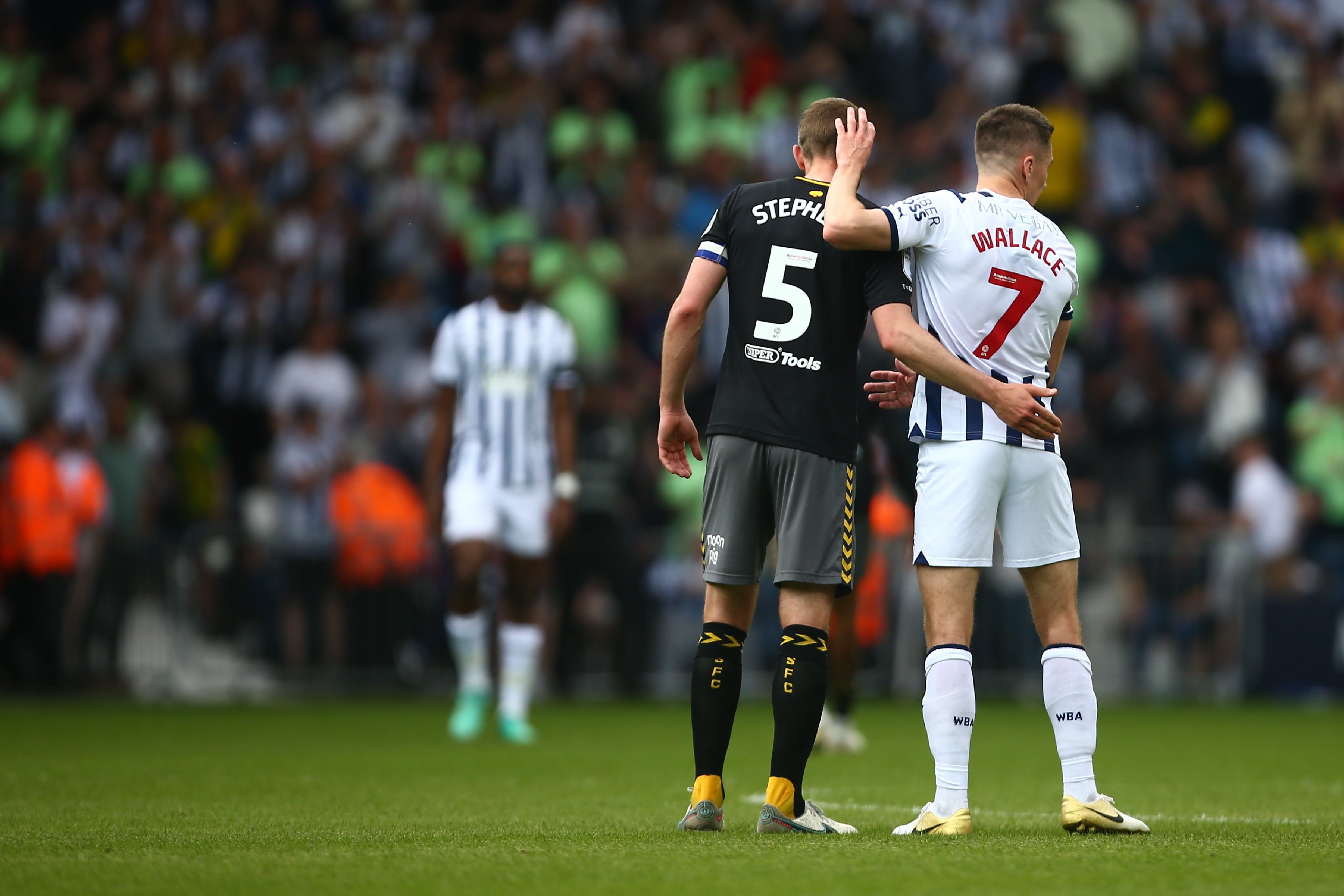 Jed Wallace and Jack Stephens embrace after the full-time whistle at The Hawthorns 