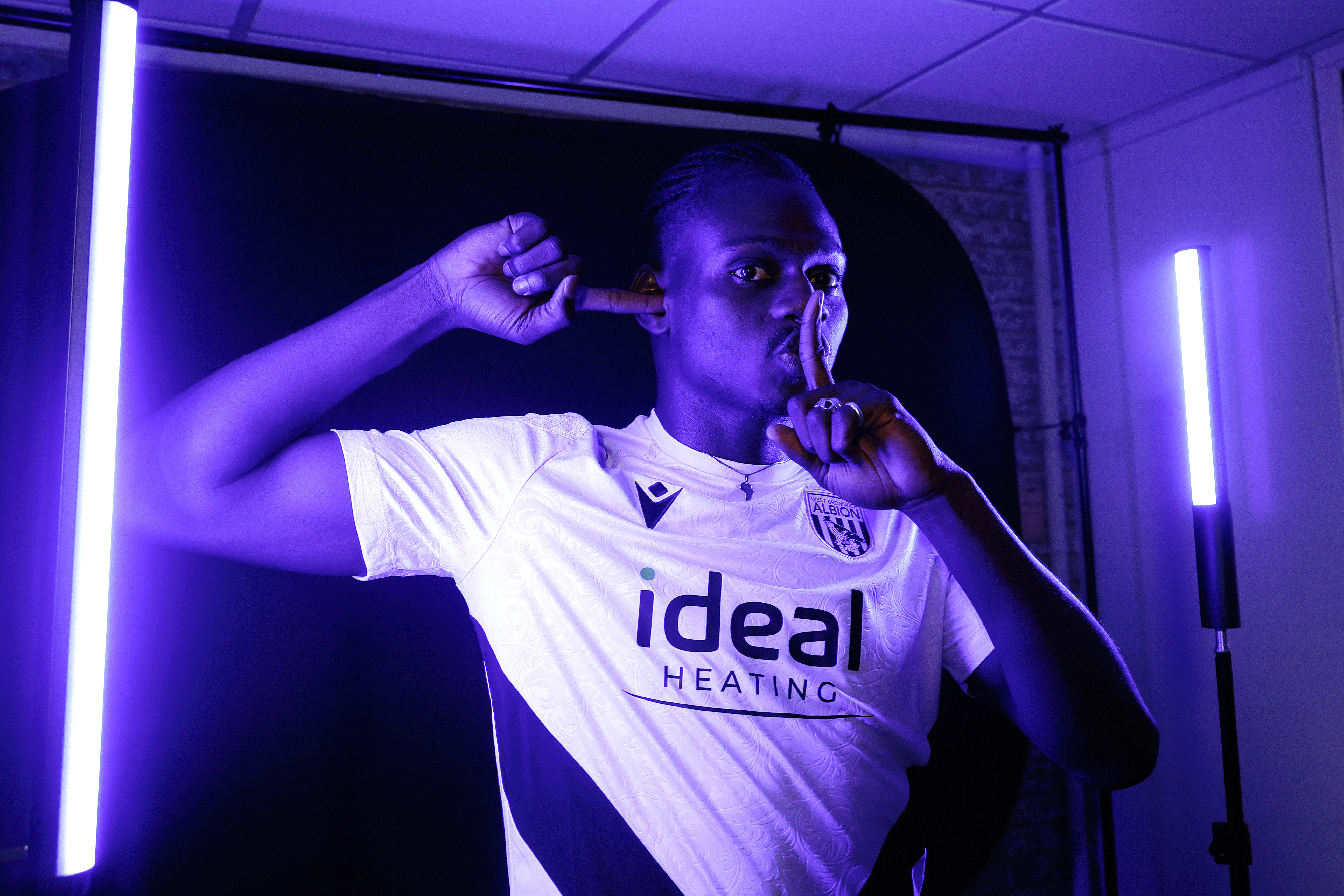 Ousmane Diakité posing for the camera inside a TV studio 