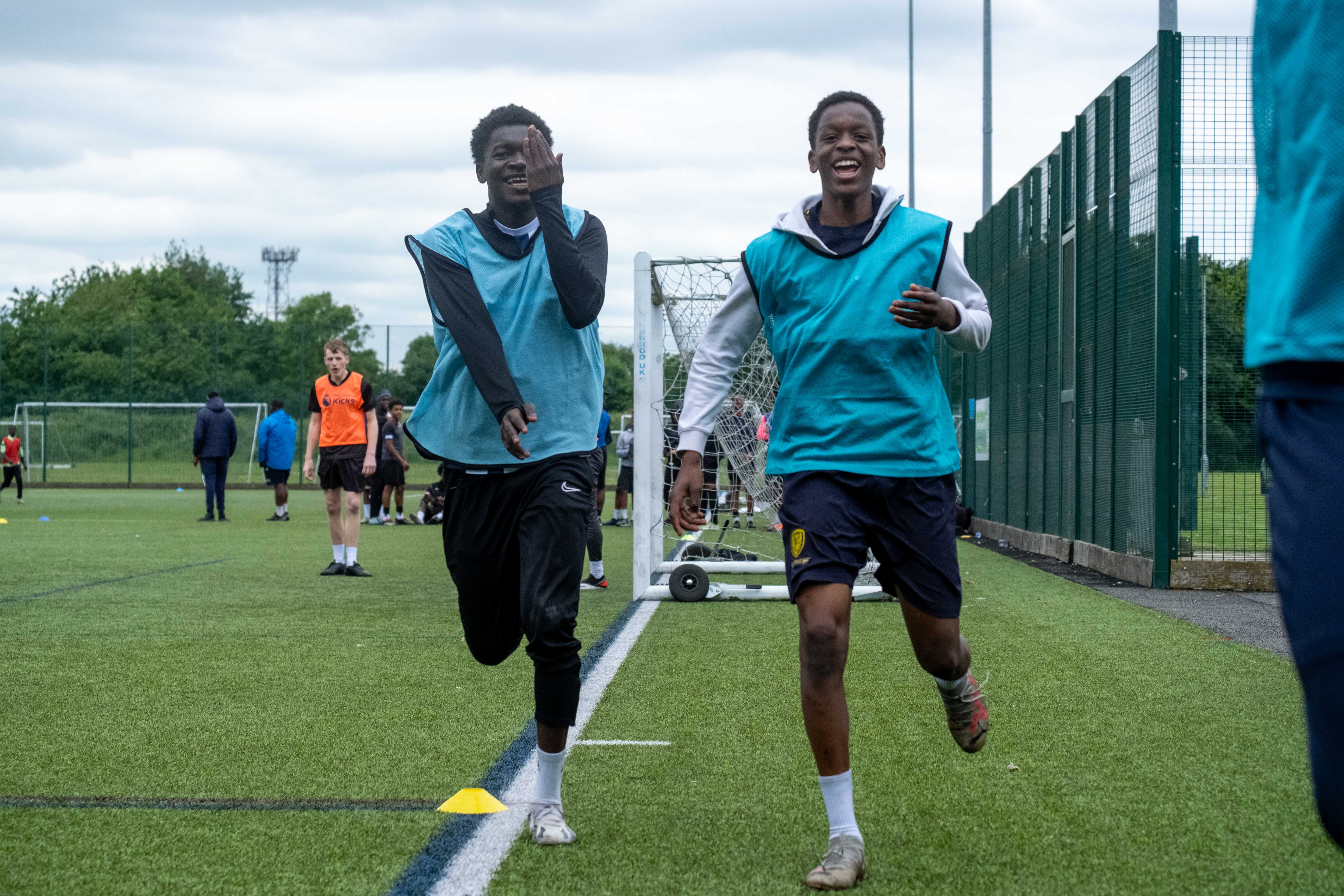 Two players celebrating a goal.