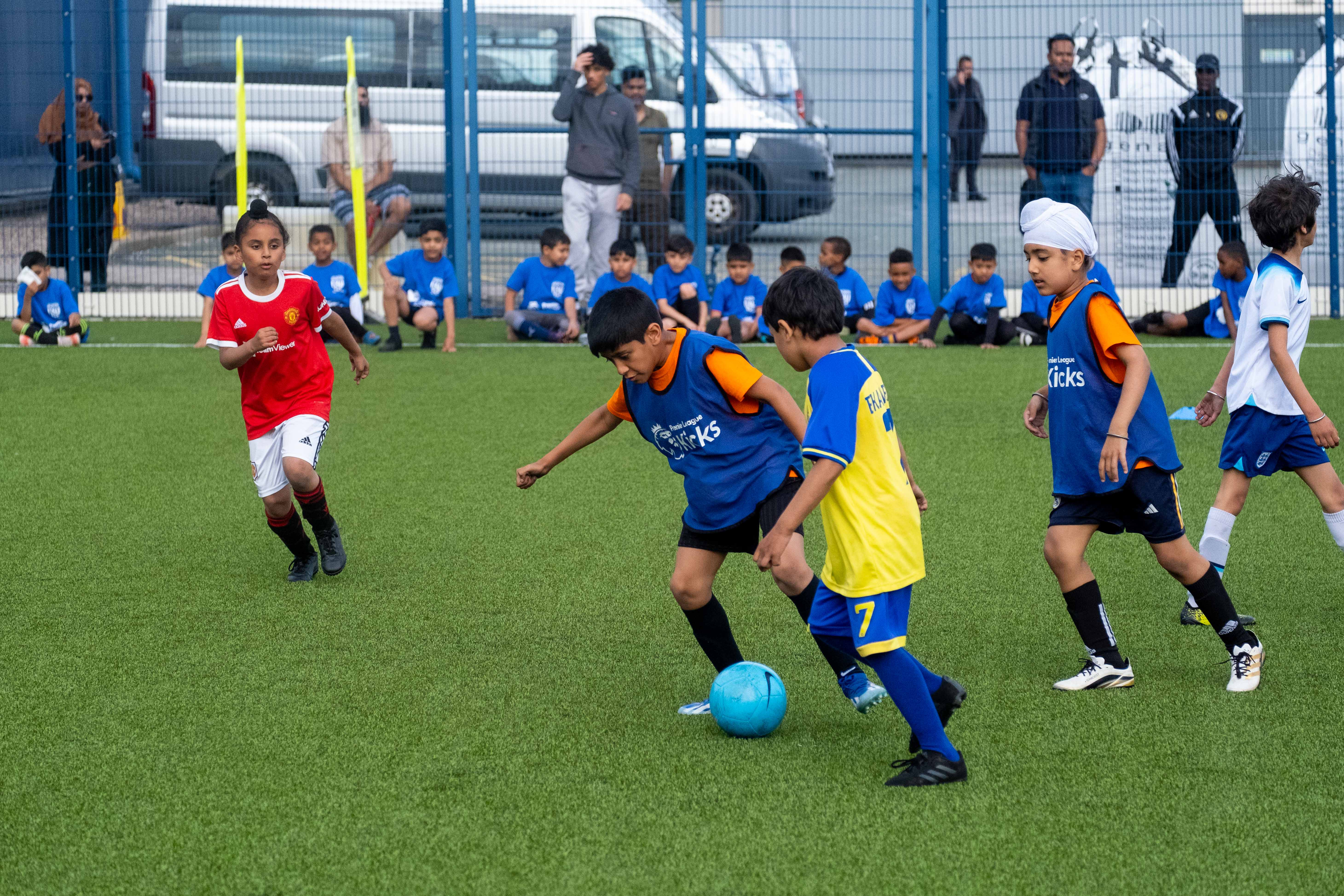 Participants at our South Asian Emerging Talent Festival compete for the ball whilst playing on the Academy pitch.