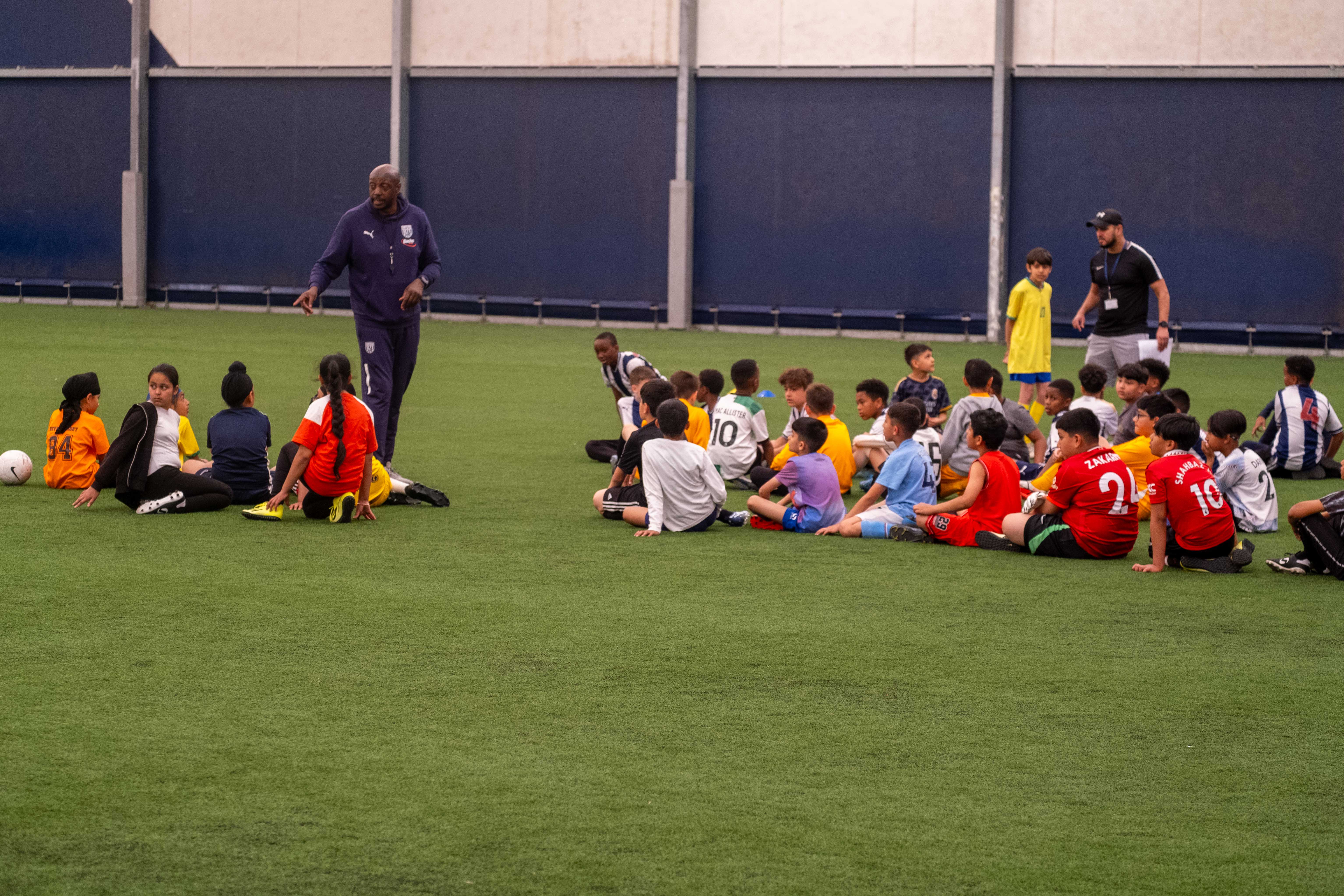 Participants at our South Asian Emerging Talent Festival receive instructions from The Albion Foundation coaches whilst inside the Academy Dome.