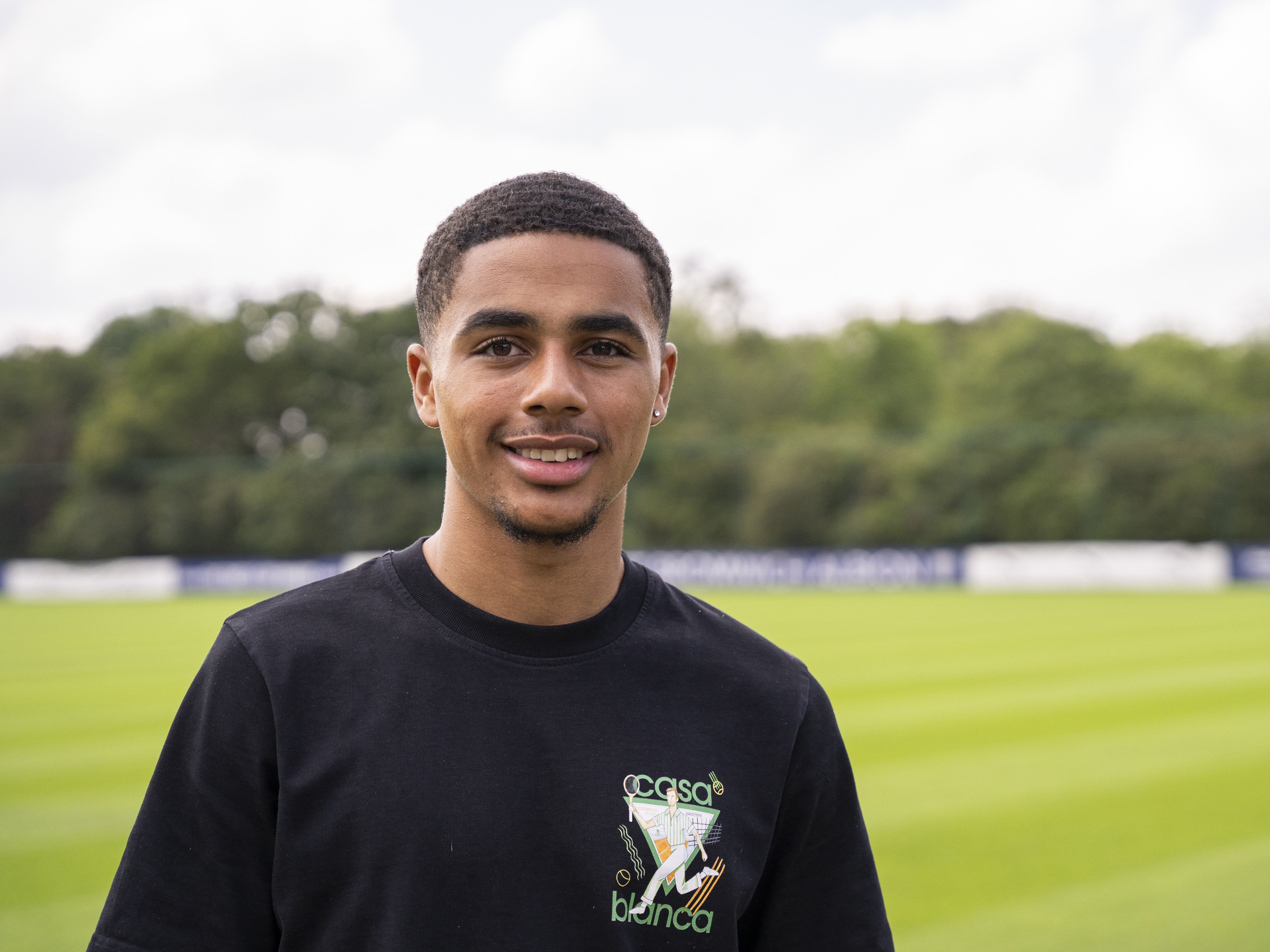 A photo of Albion youngster Deago Nelson with the backing of the club's training ground behind