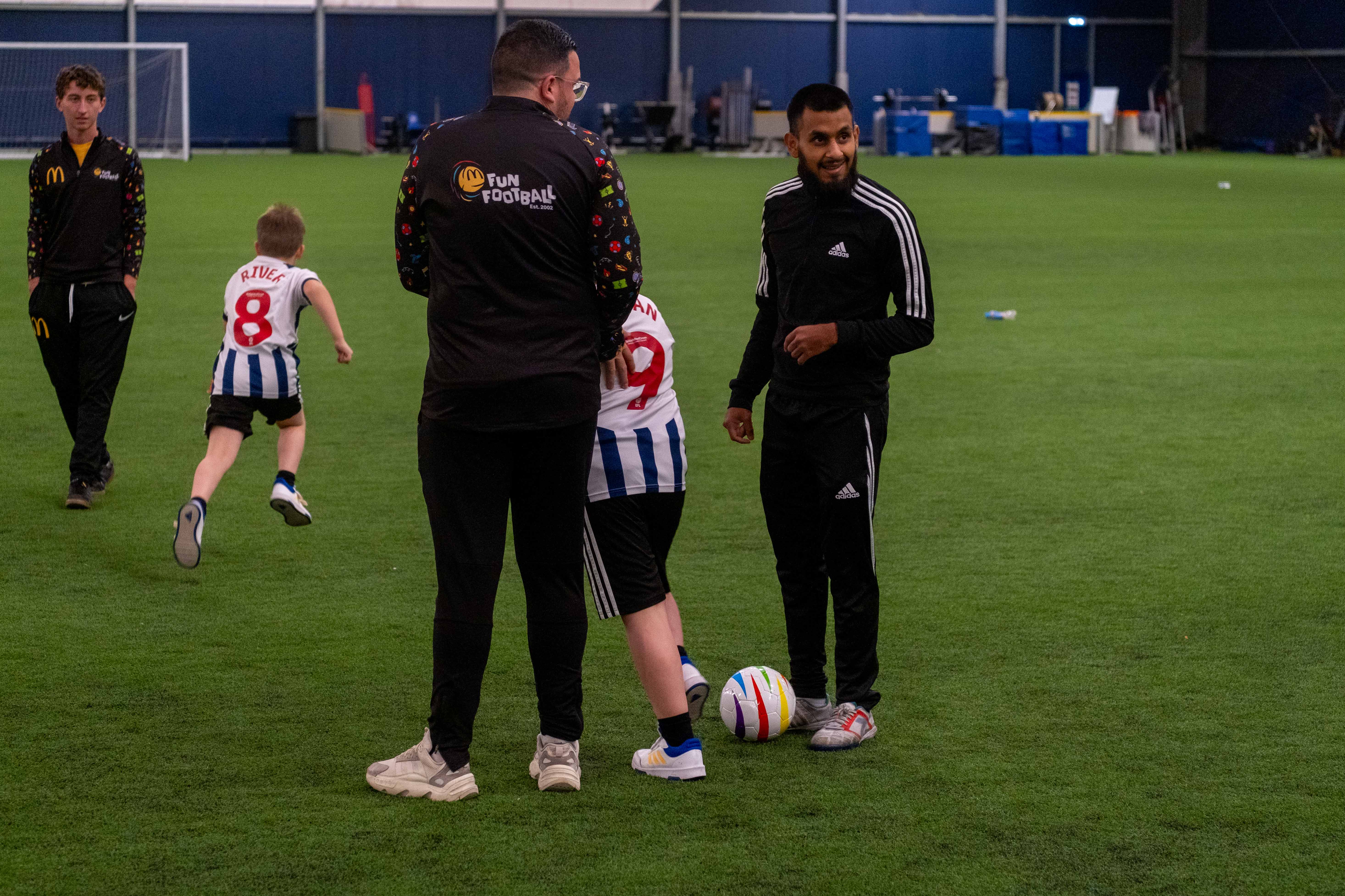 Eesa engages with young footballers during the McDonald's Fun Football Session.