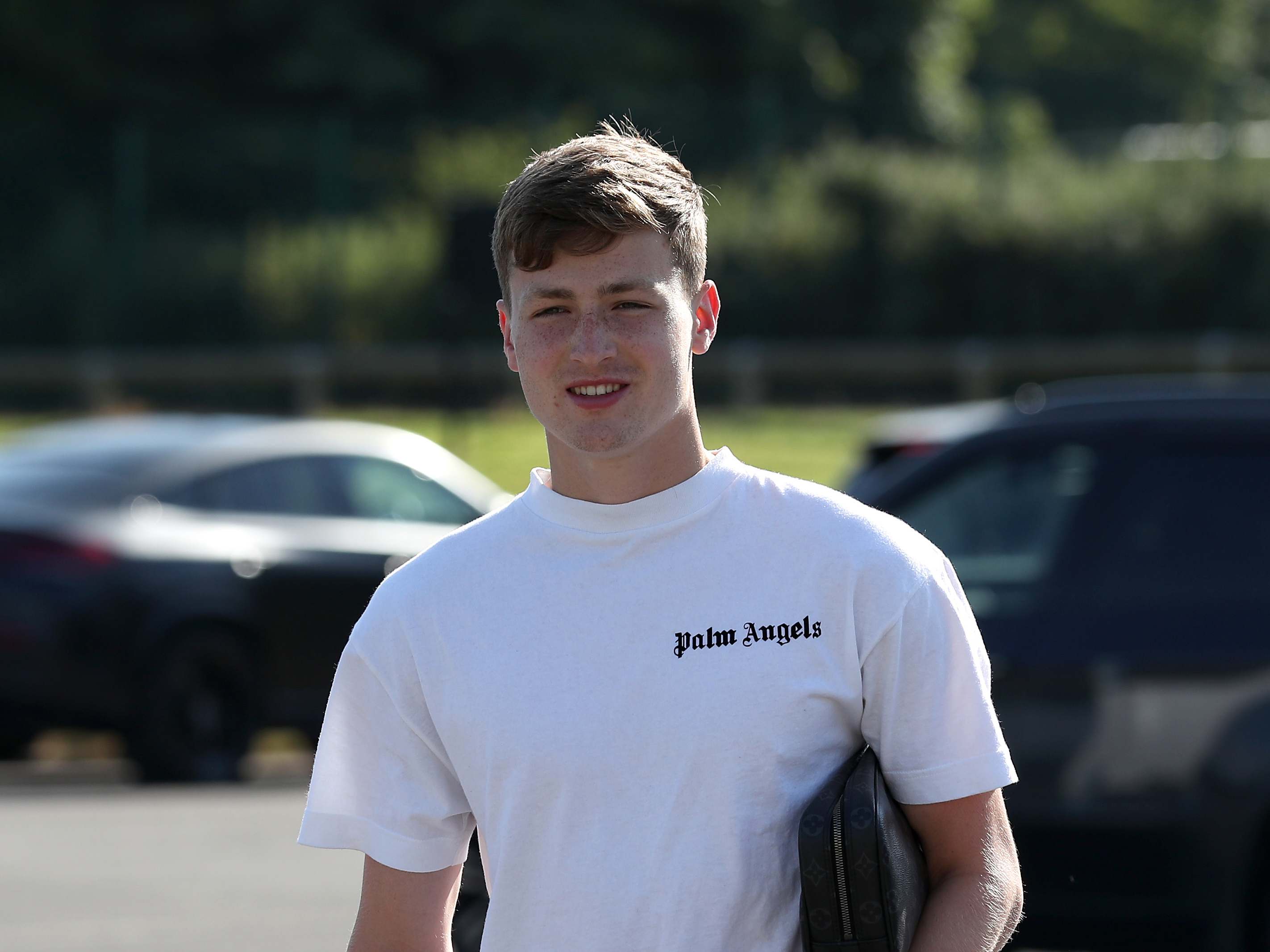 Zac Ashworth arriving at the training ground smiling 