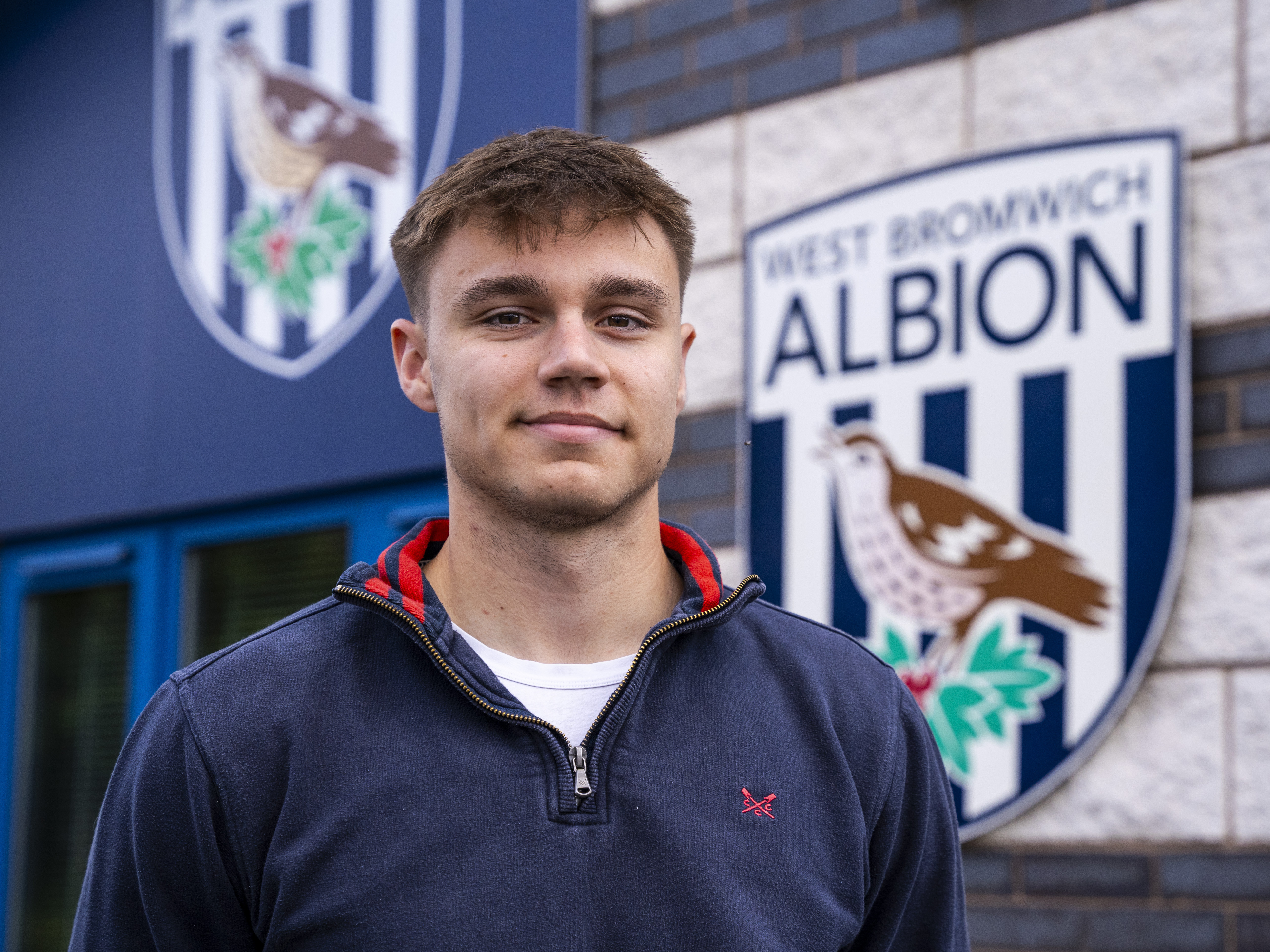 A photo of Albion youngster Evan Humphries in front of the club's training ground