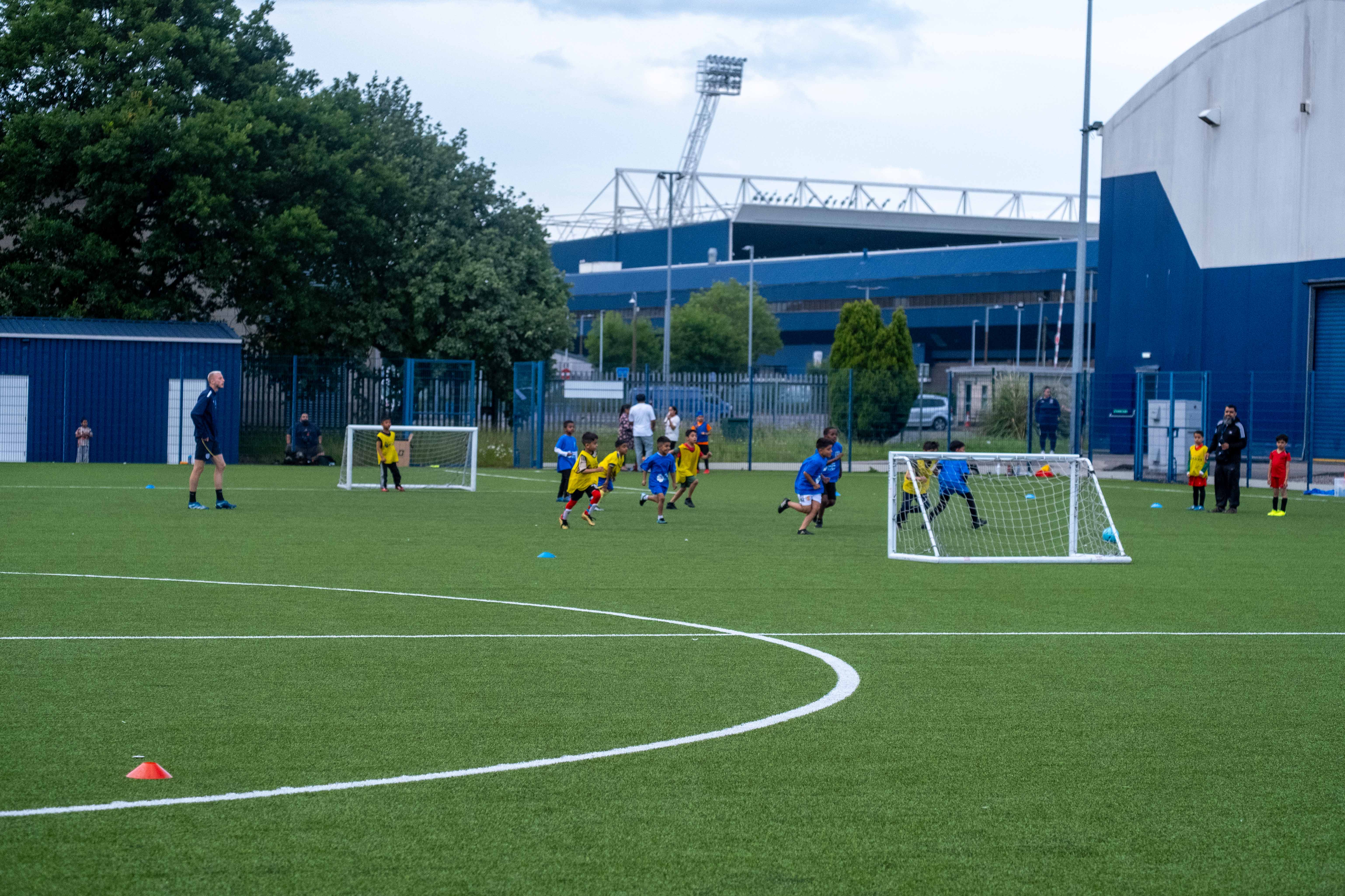 Players enjoy their match at the South Asian Emerging Talent Festival with the backdrop of The Hawthorns.