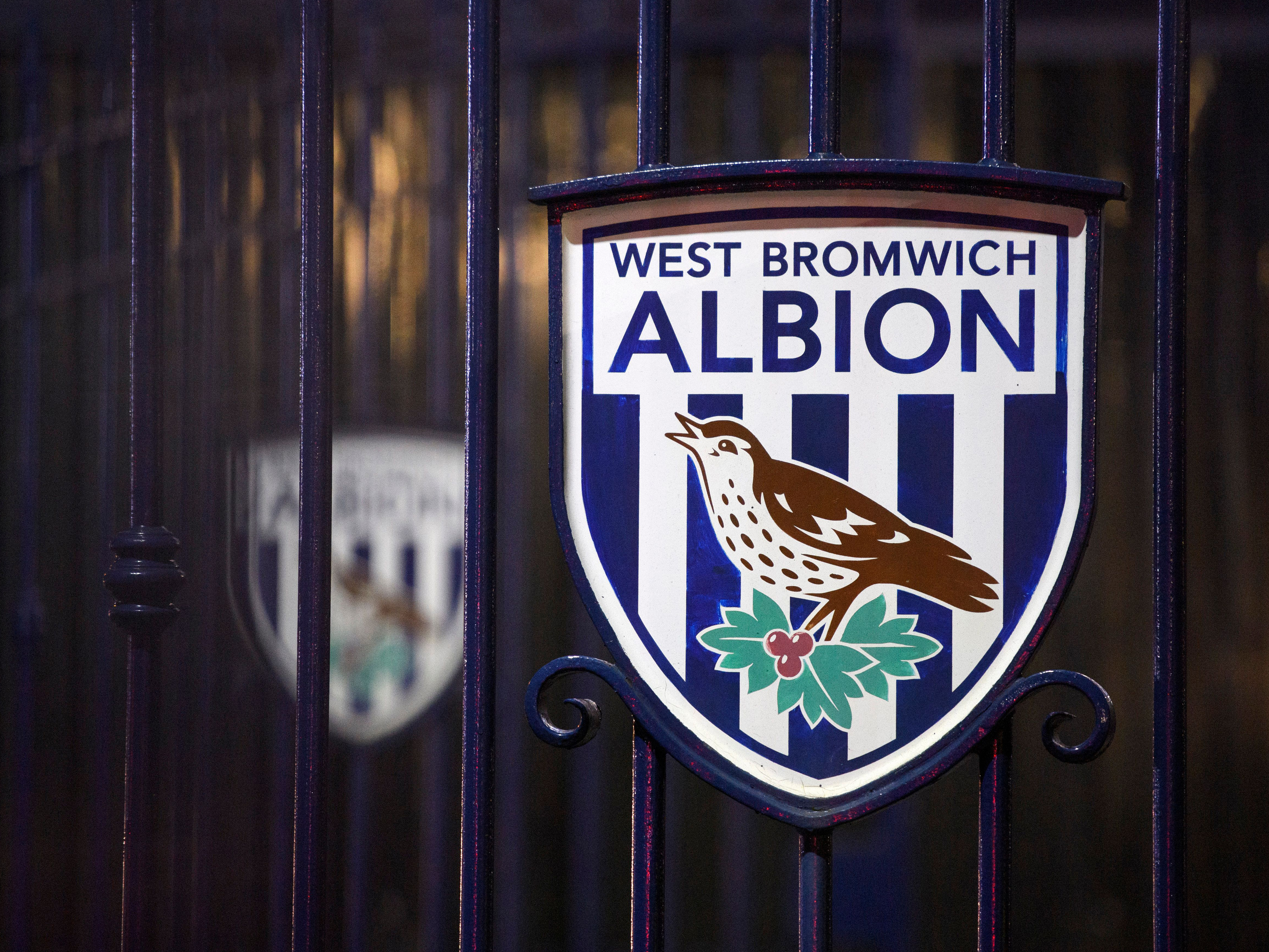 An image of a club crest on the gates outside The Hawthorns