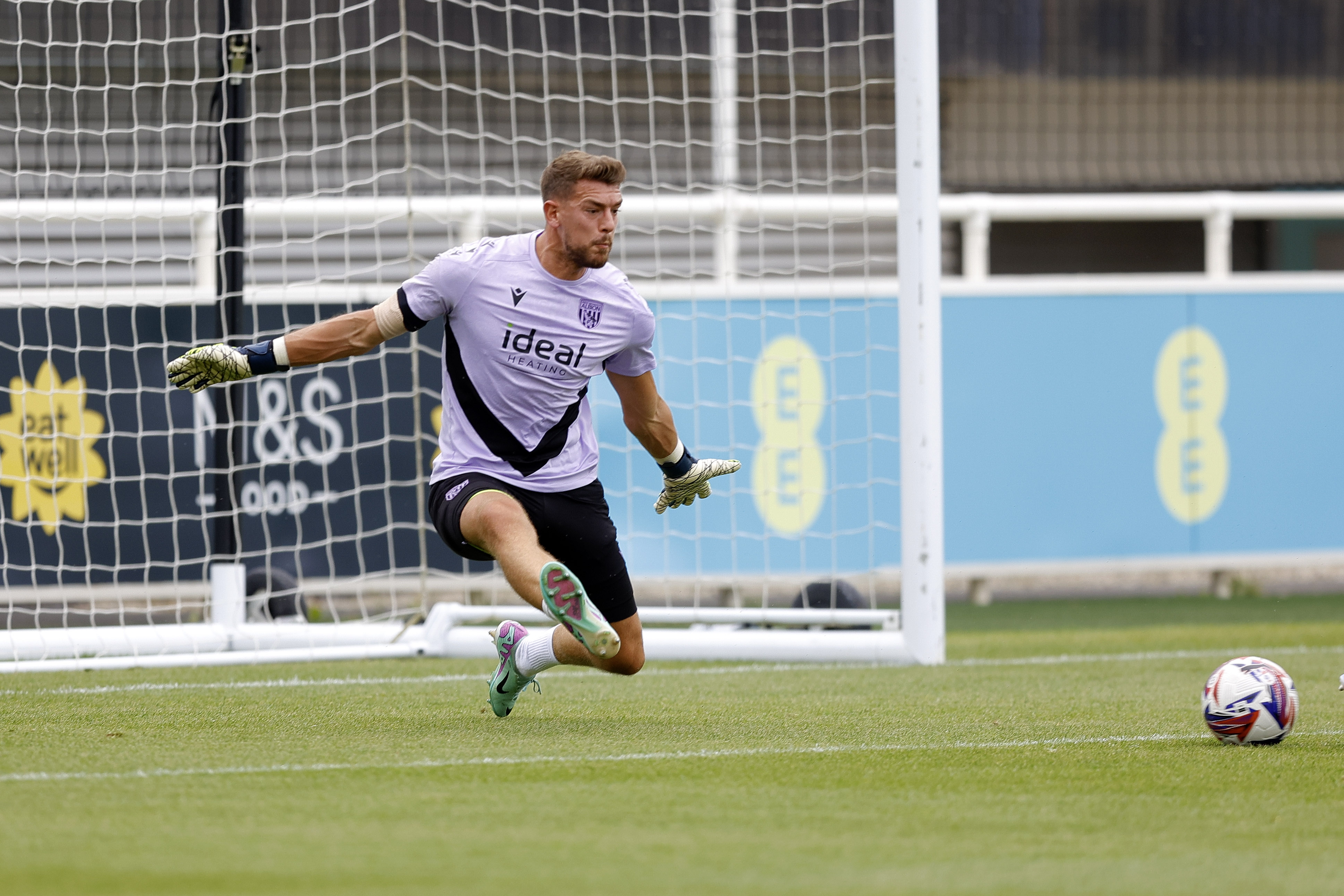 An image of Alex Palmer warming up for Albion's friendly against Peterborough