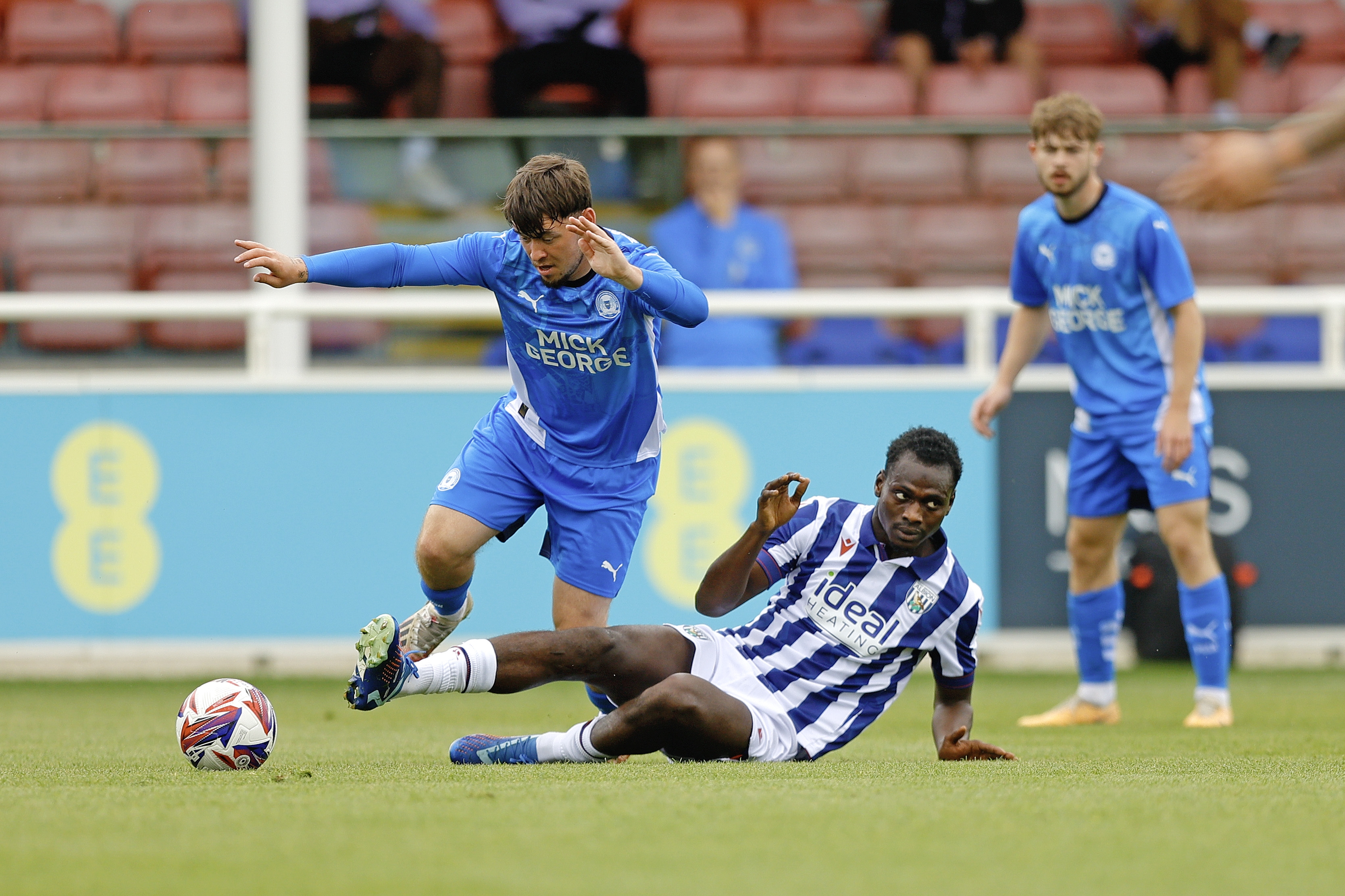 An image of Ousmane Diakite putting in a tackle during Albion's friendly against Peterborough