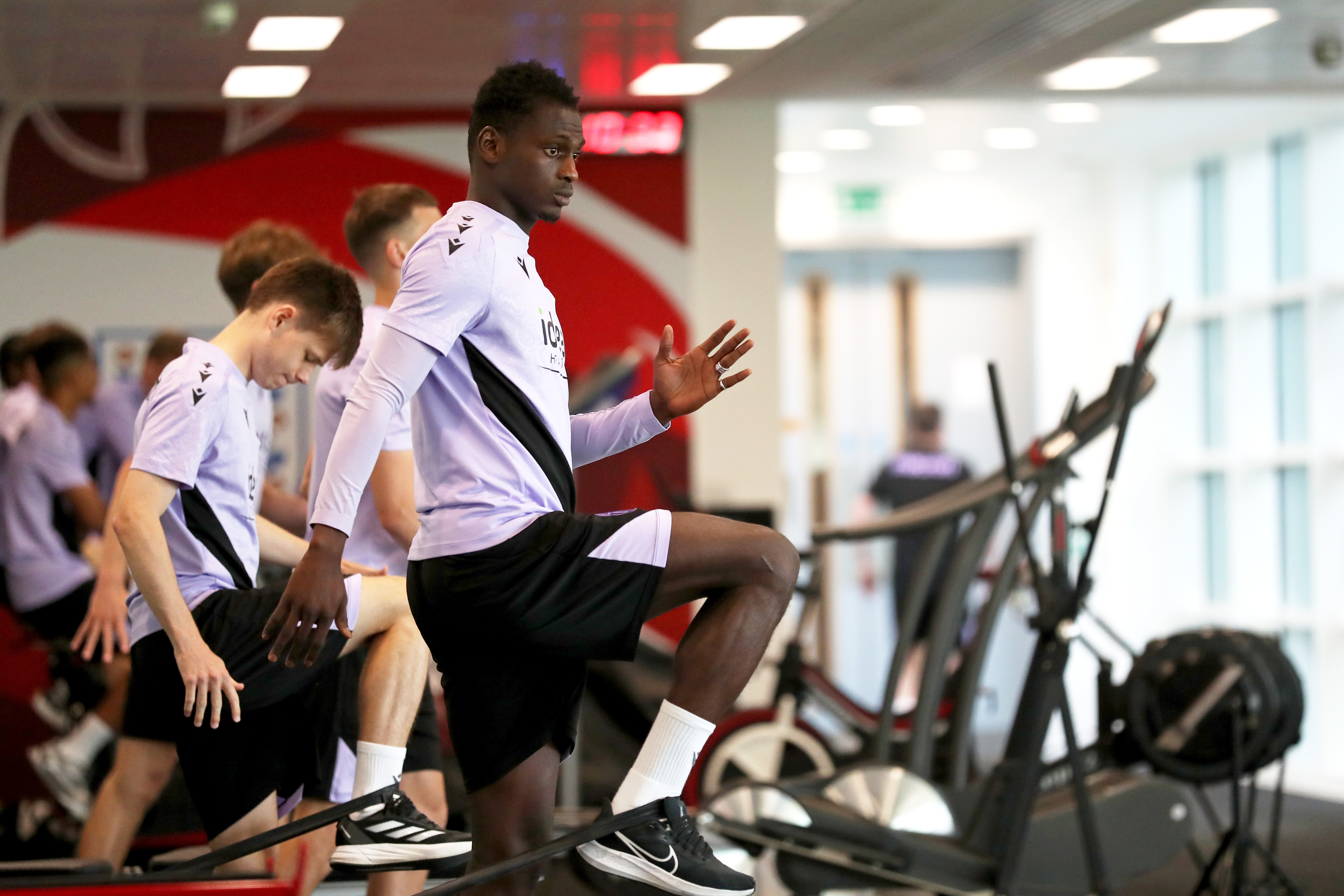 Ousmane Diakité stretching in the gym at St. George's Park