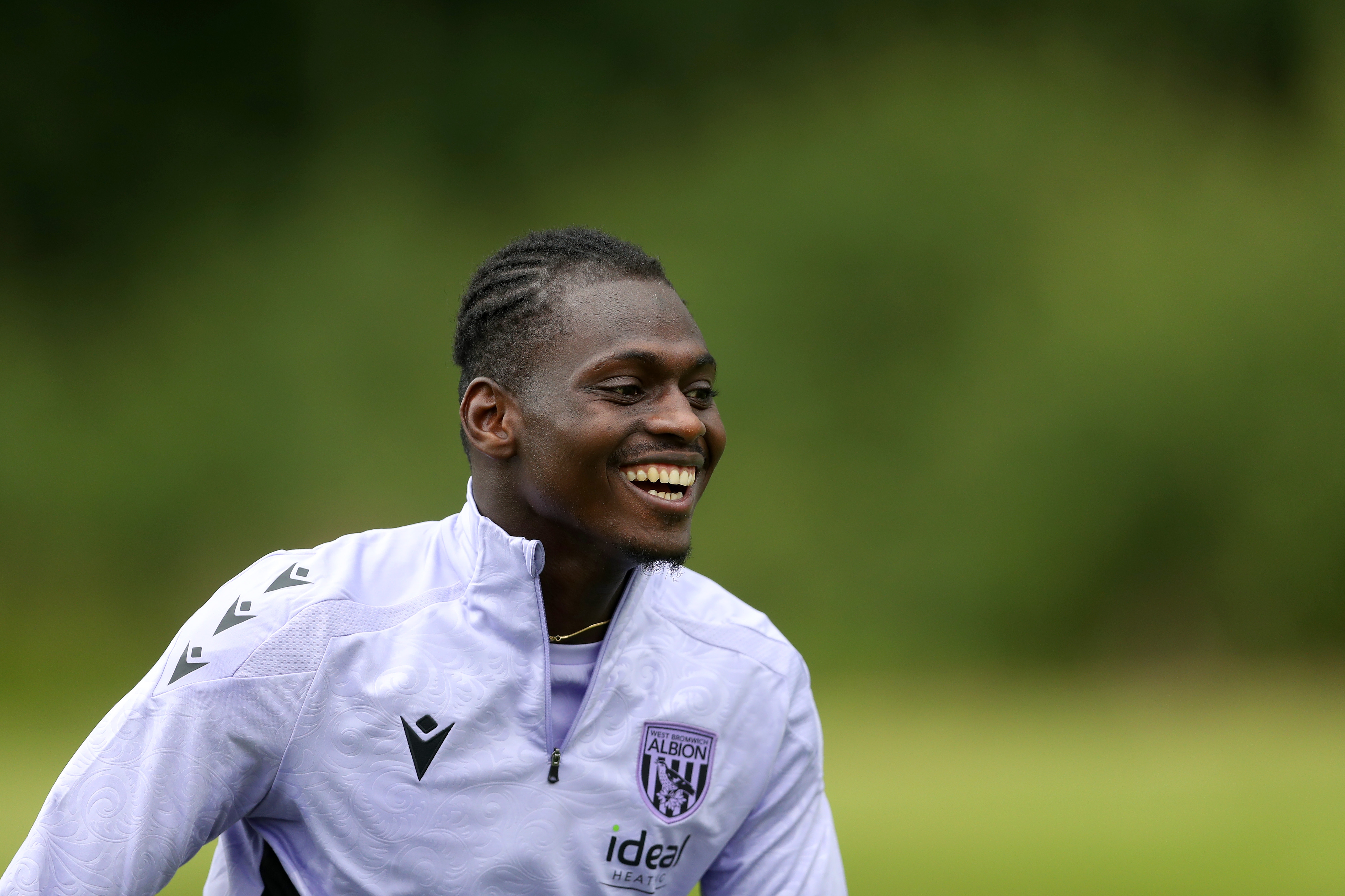 Ousmane Diakité smiling during a training session