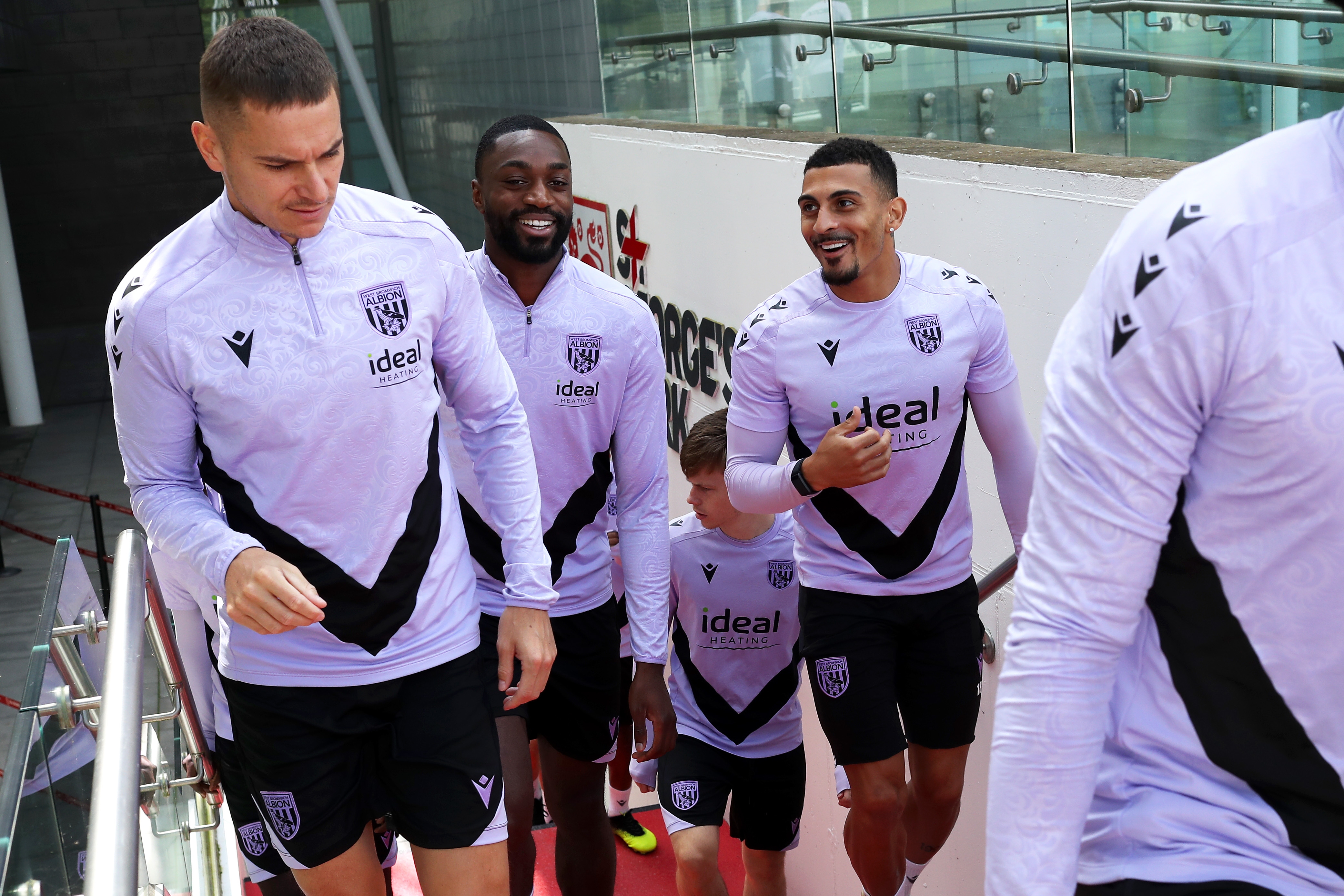 Conor Townsend, Semi Ajayi and Karlan Grant walking up the steps to the training pitch at St. George's Park