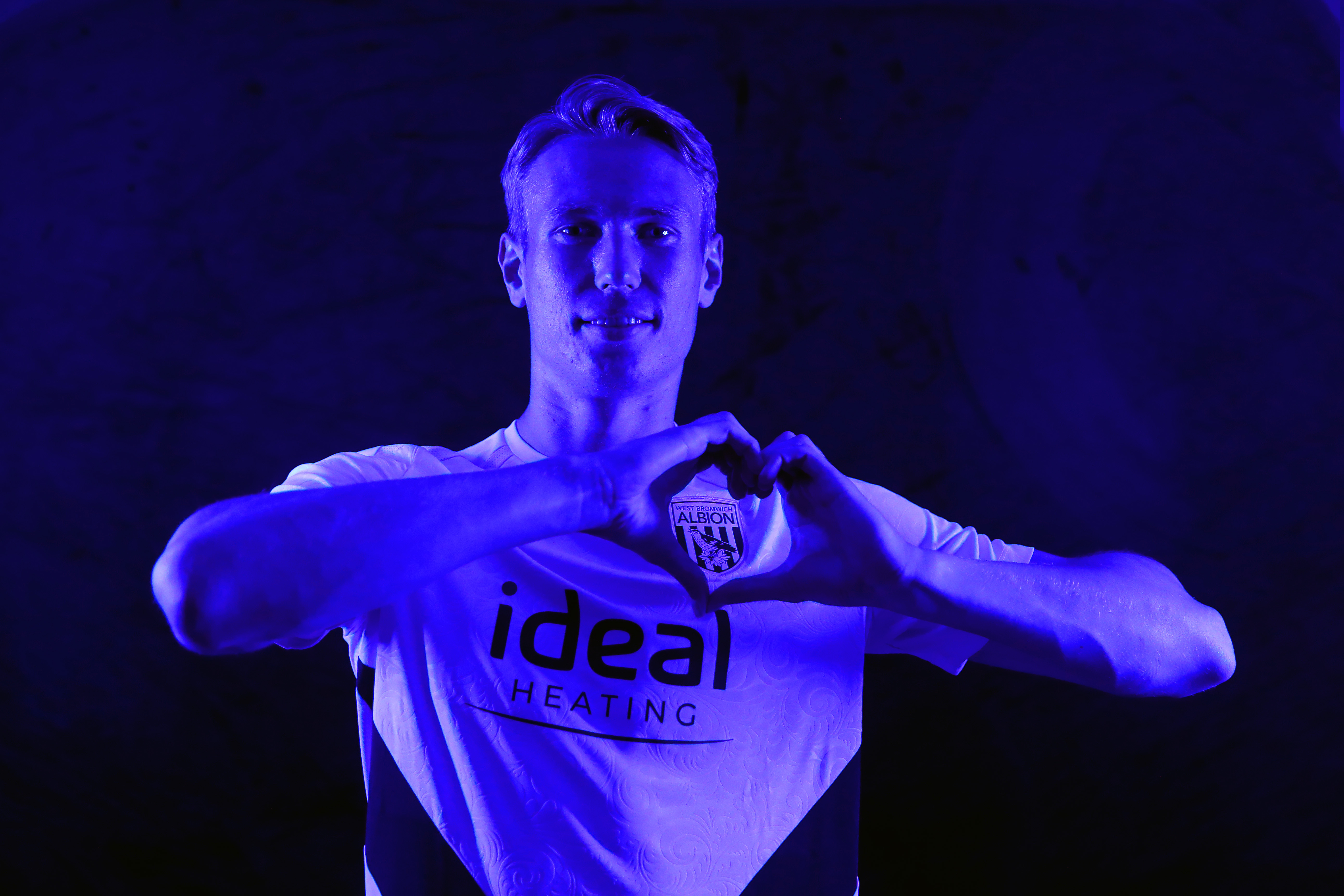 Torbjørn Heggem making a heart shape with his hands 