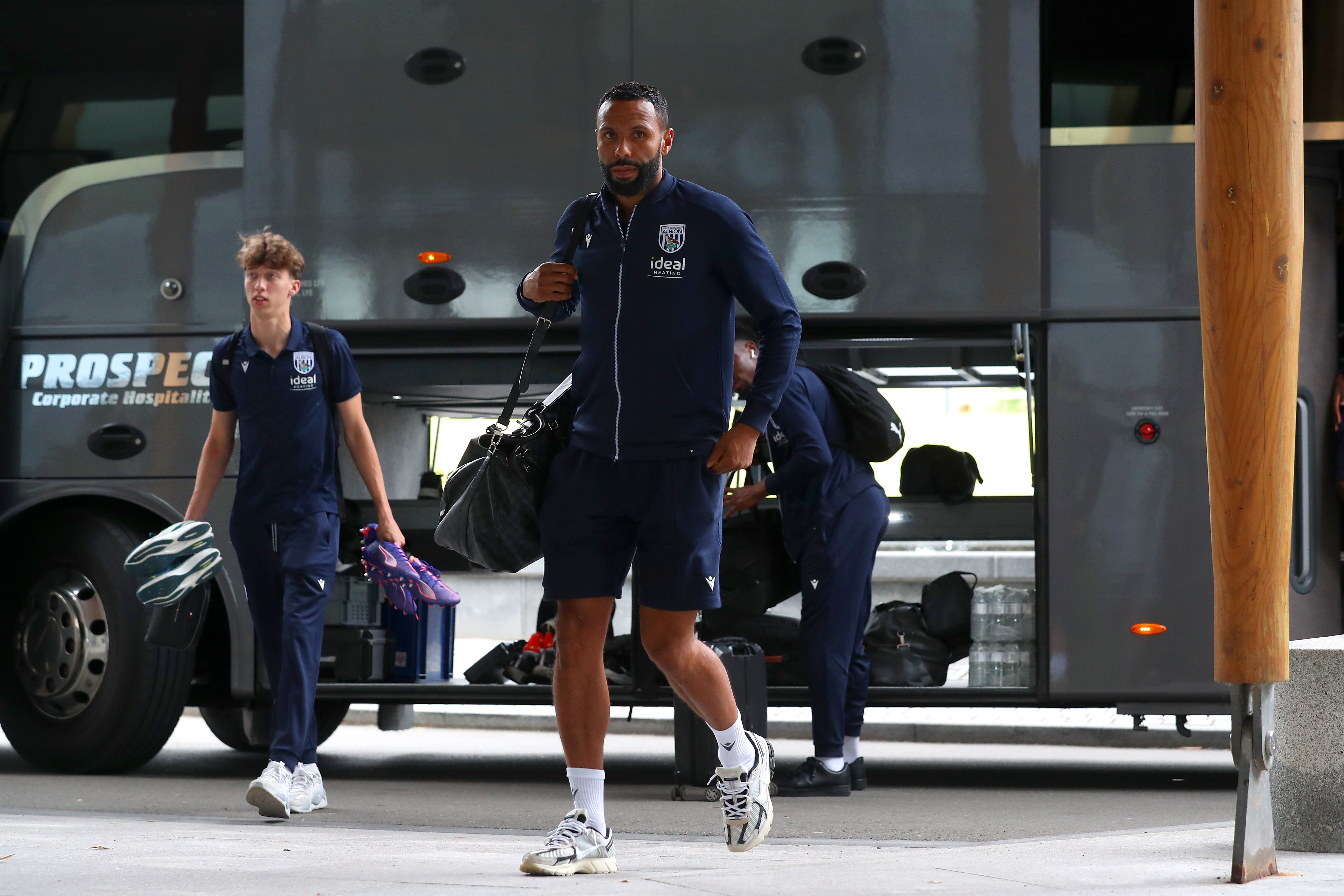 Kyle Bartley arriving at St. George's Park holding a bag