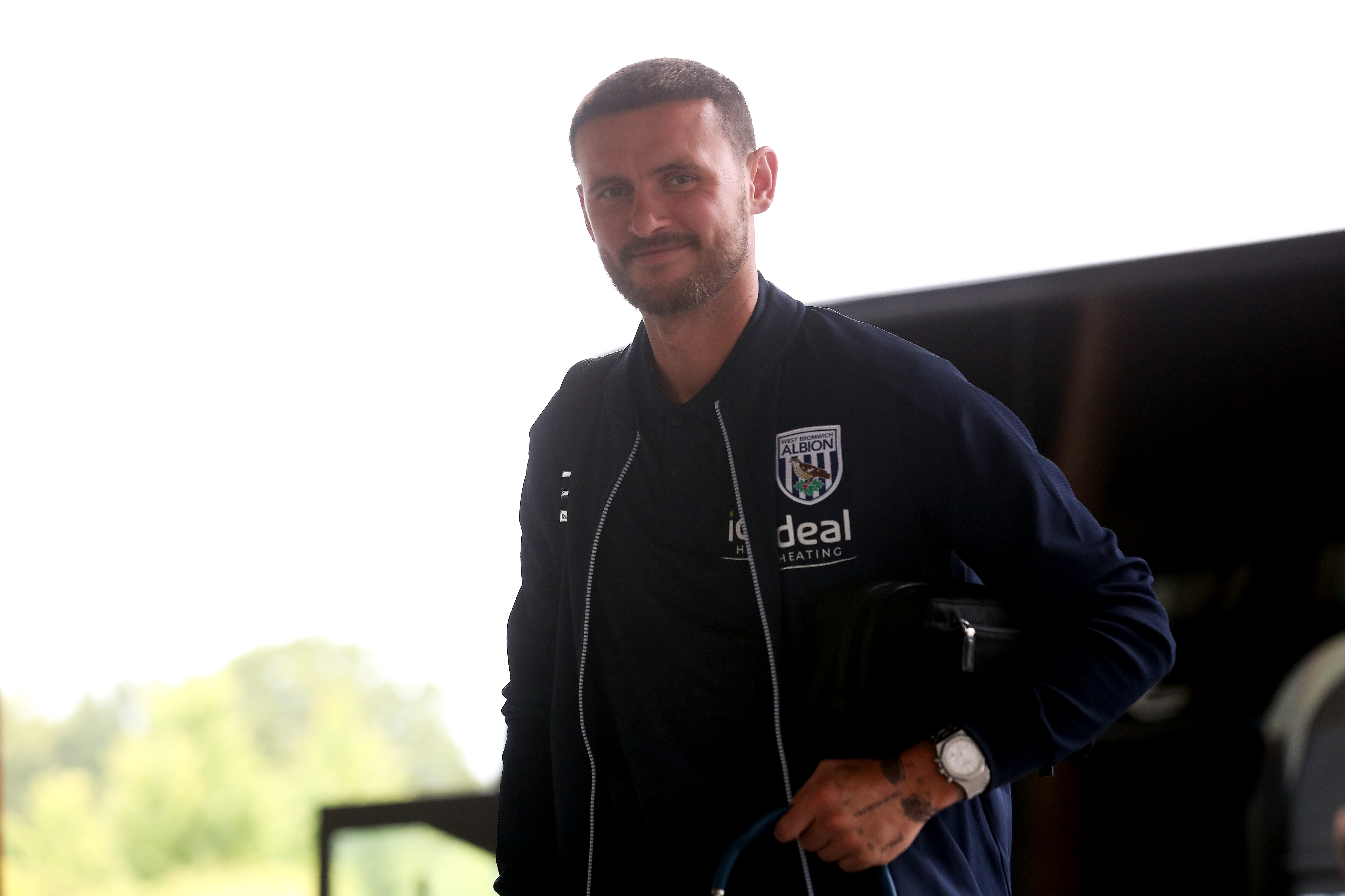 John Swift arriving at St. George's Park smiling at the camera 