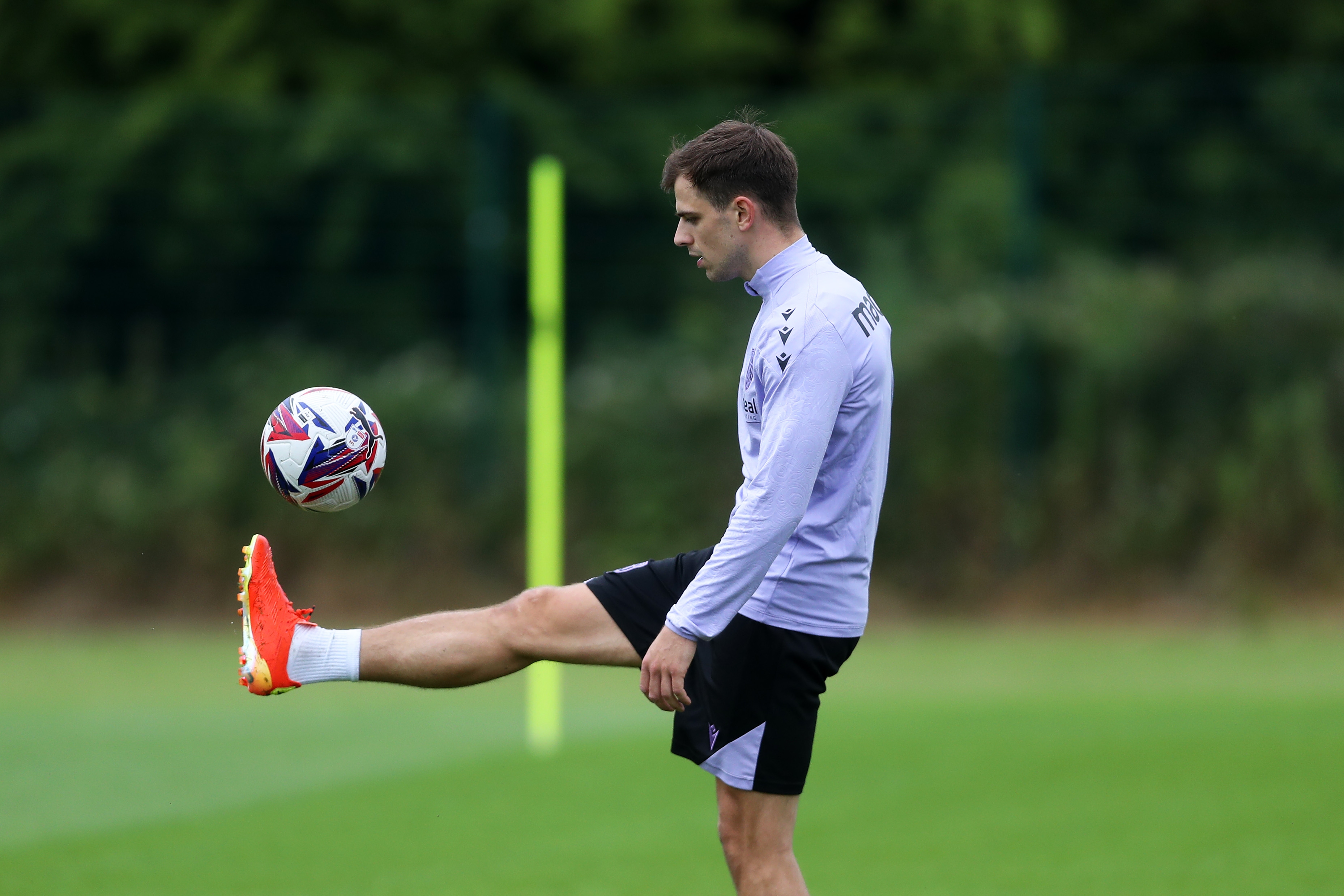 Jayson Molumby controlling a ball during a training session 