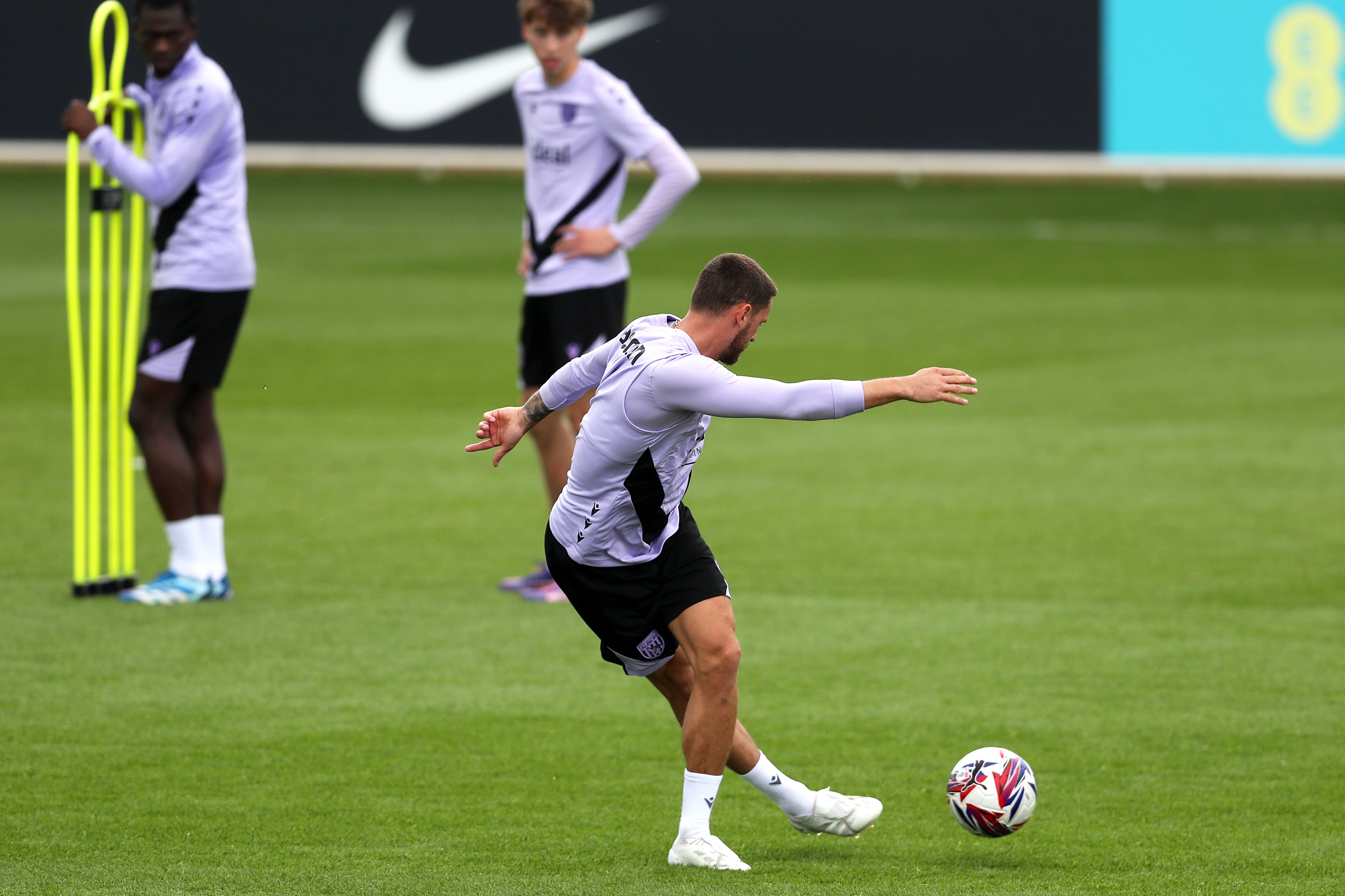 John Swift pulling off a rabona pass during training at St. George's Park