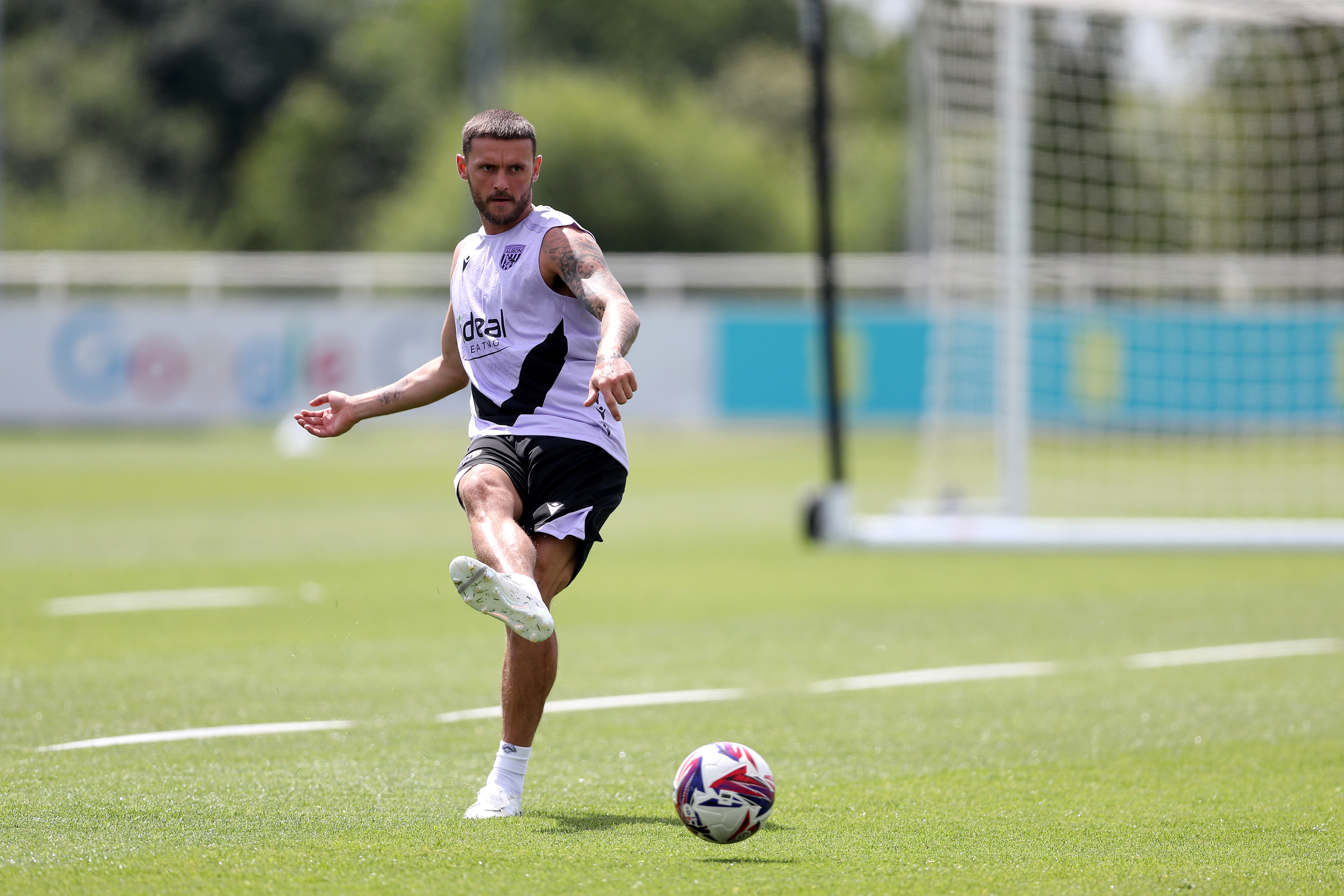 John Swift passing the ball during a training session at St. George's Park