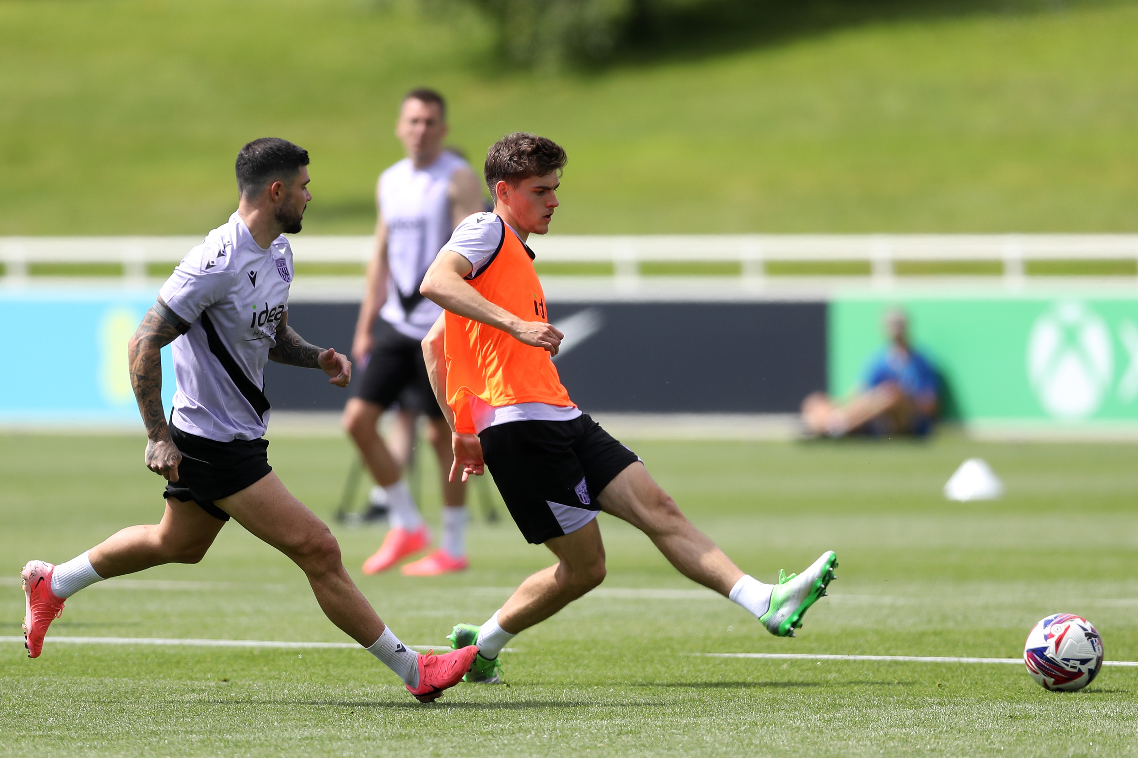 Tom Fellows passing the ball during a training session at St. George's Park