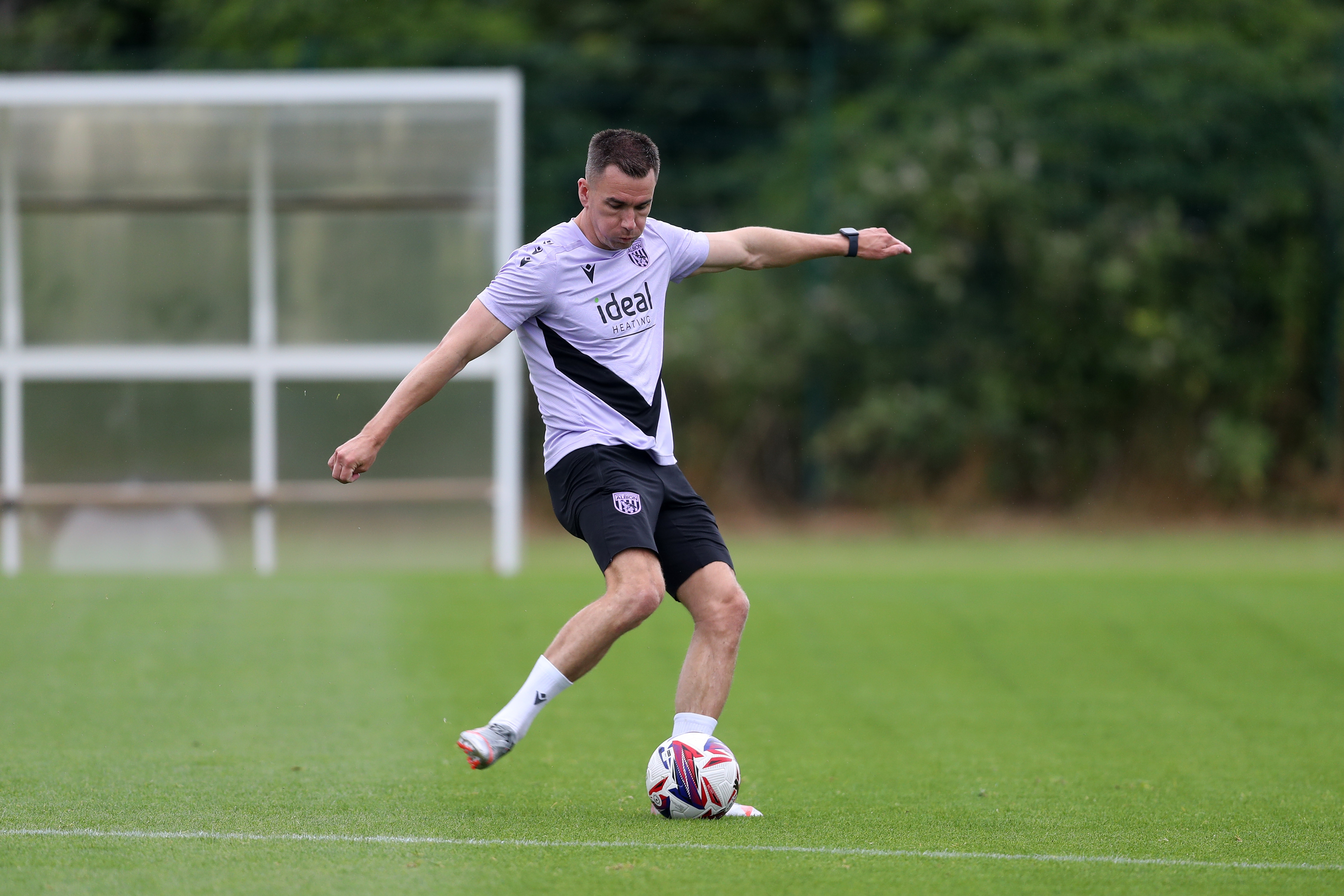 Jed Wallace striking the ball during a training session 
