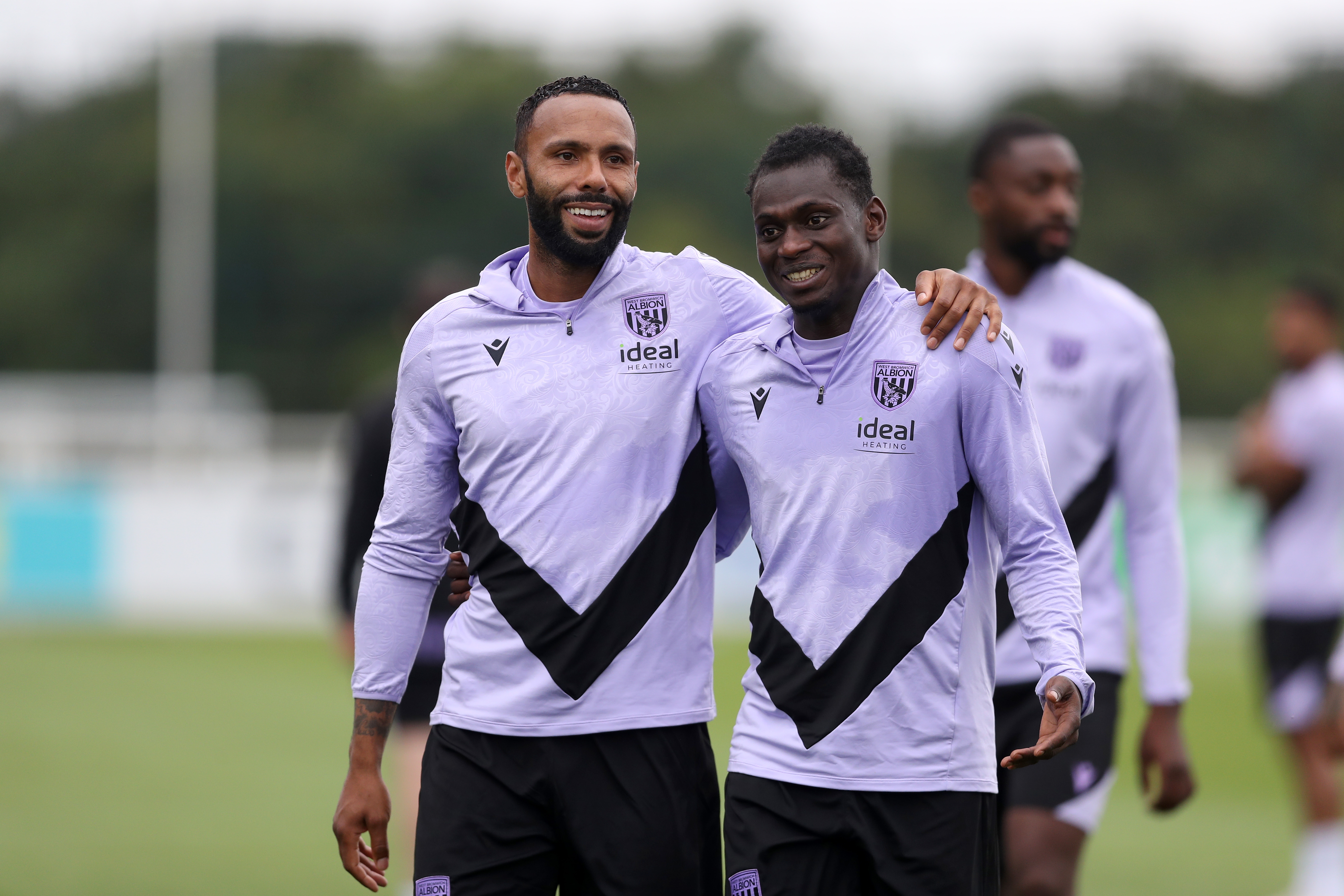 Kyle Bartley and Ousmane Diakité smiling during a training session at St. George's Park