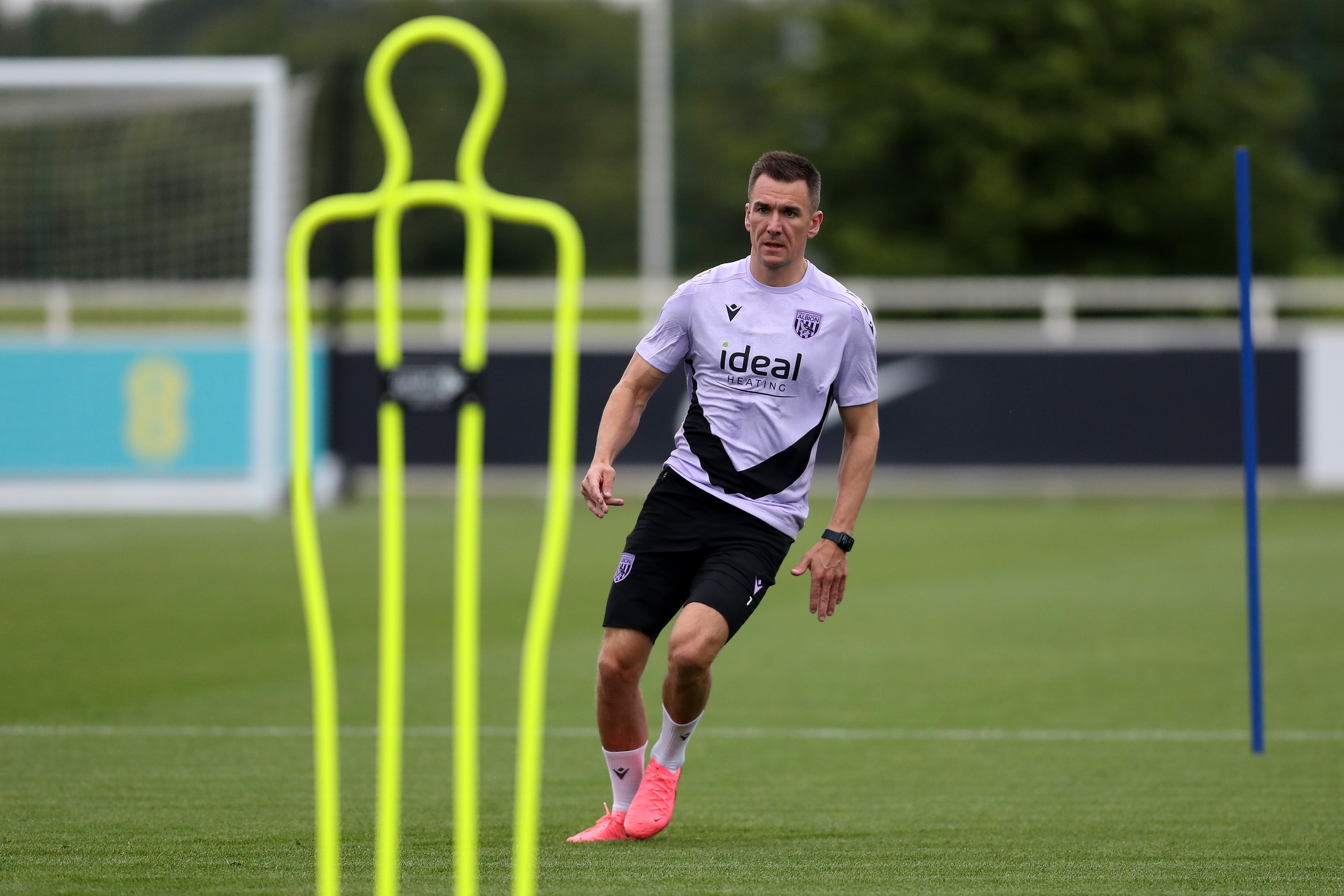 Jed Wallace stood by a mannequin during a training session at St. George's Park