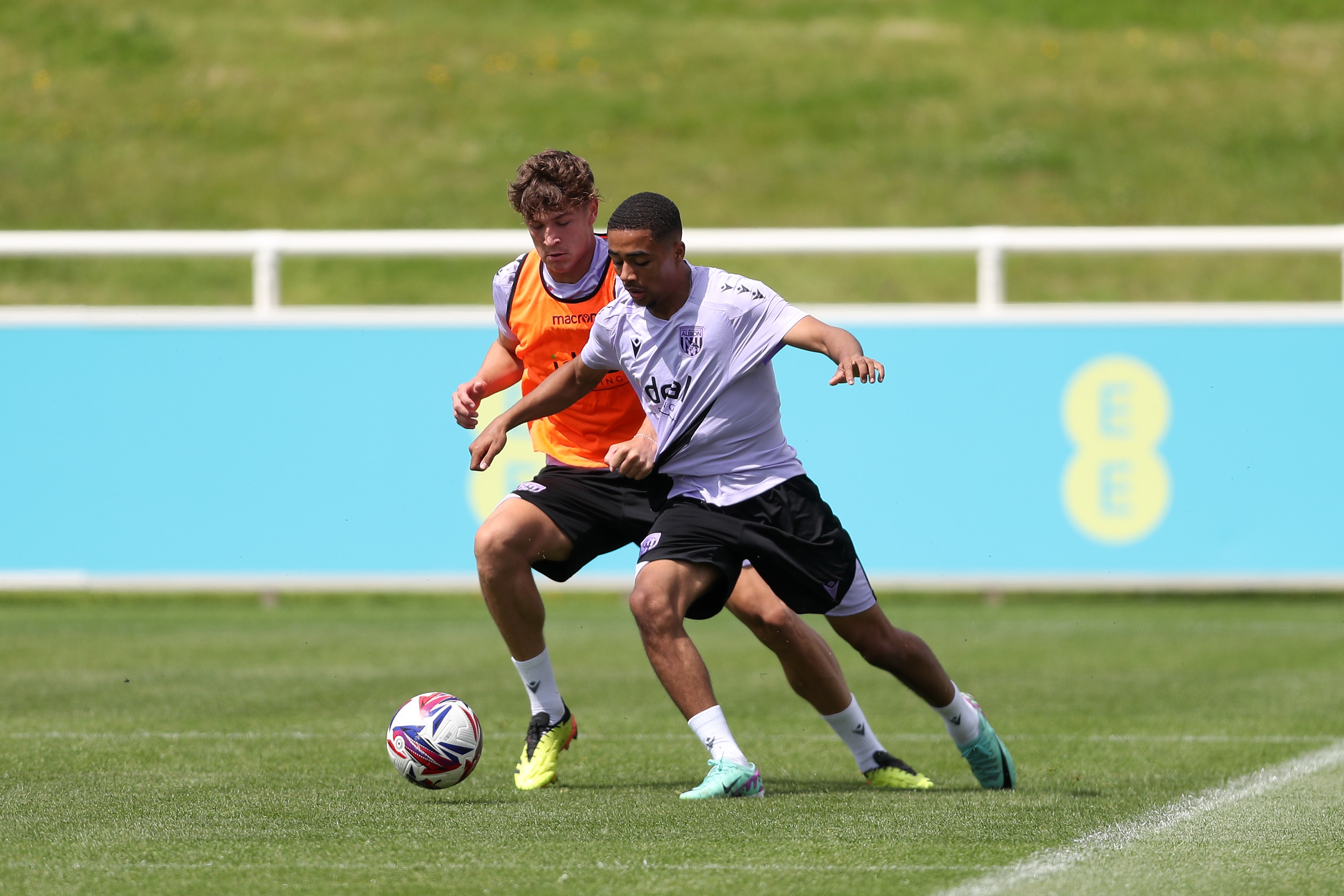 Cole Deeming and Deago Nelson battle for the ball during a training session at St. George's Park